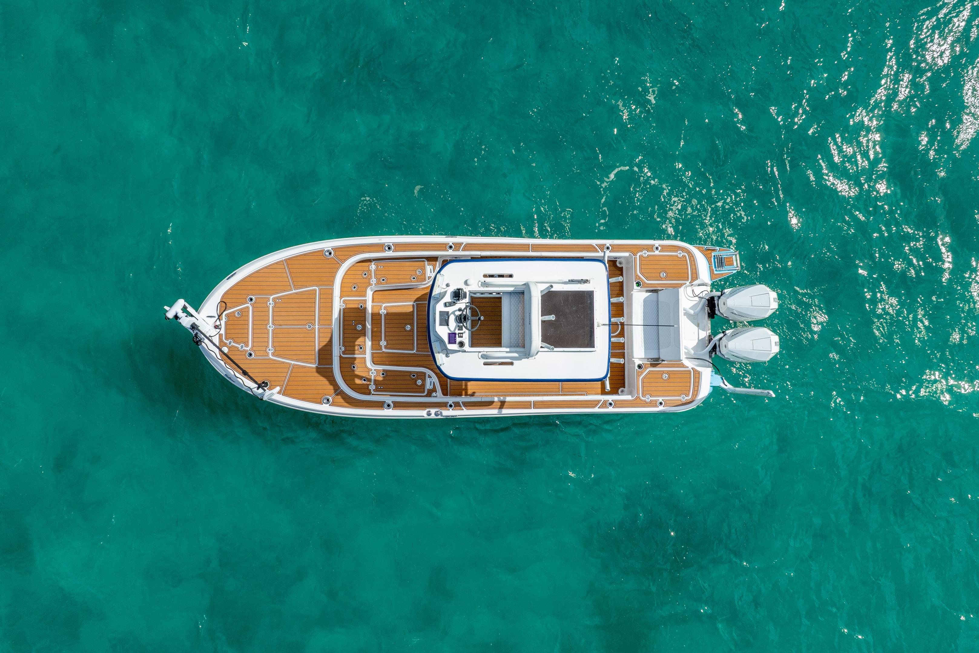 Overhead view of 2024 Caymas 281 HB boat on turquoise water.