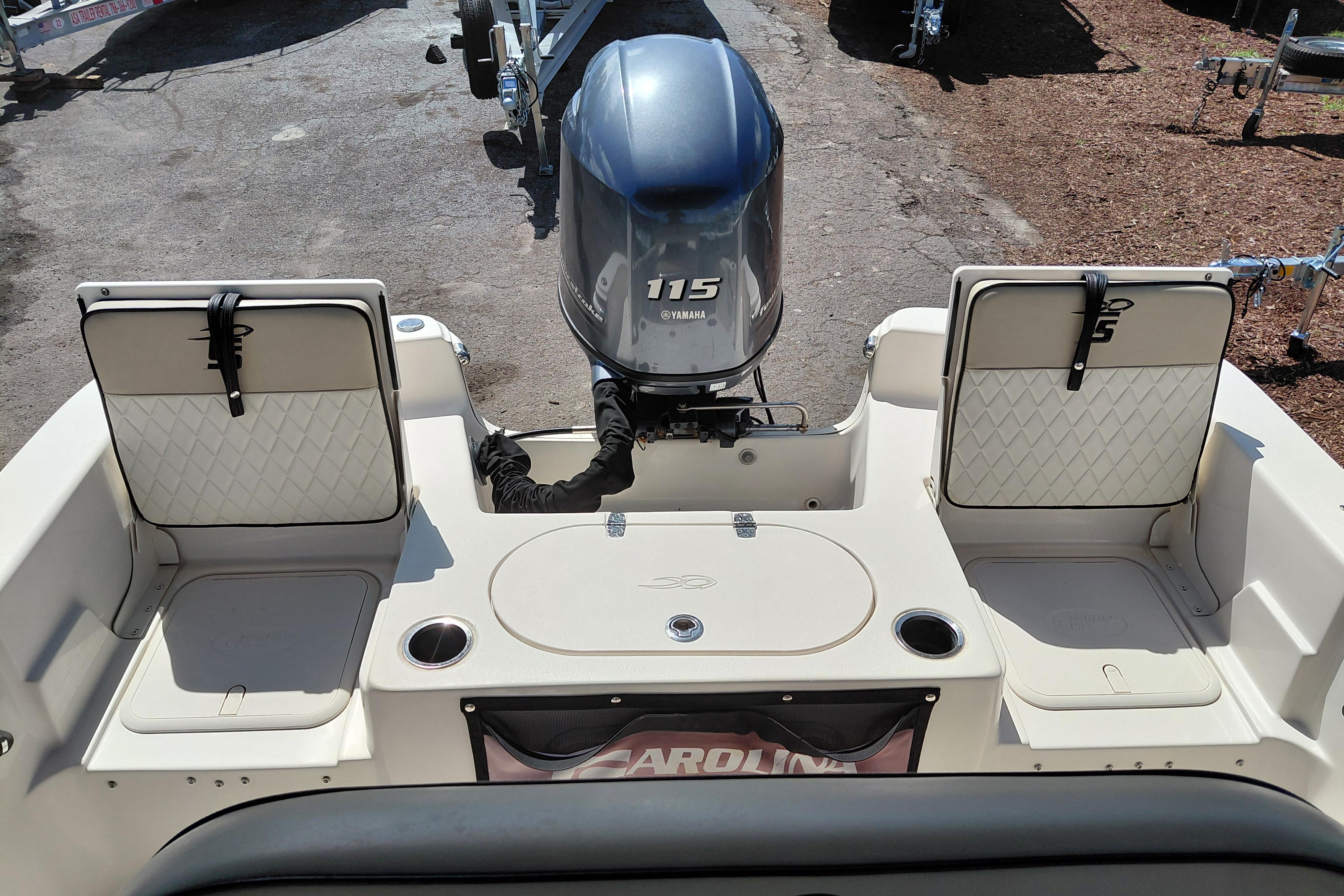 2020 Carolina Skiff 19 LS boat with Yamaha 115 engine, featuring rear seating and storage.