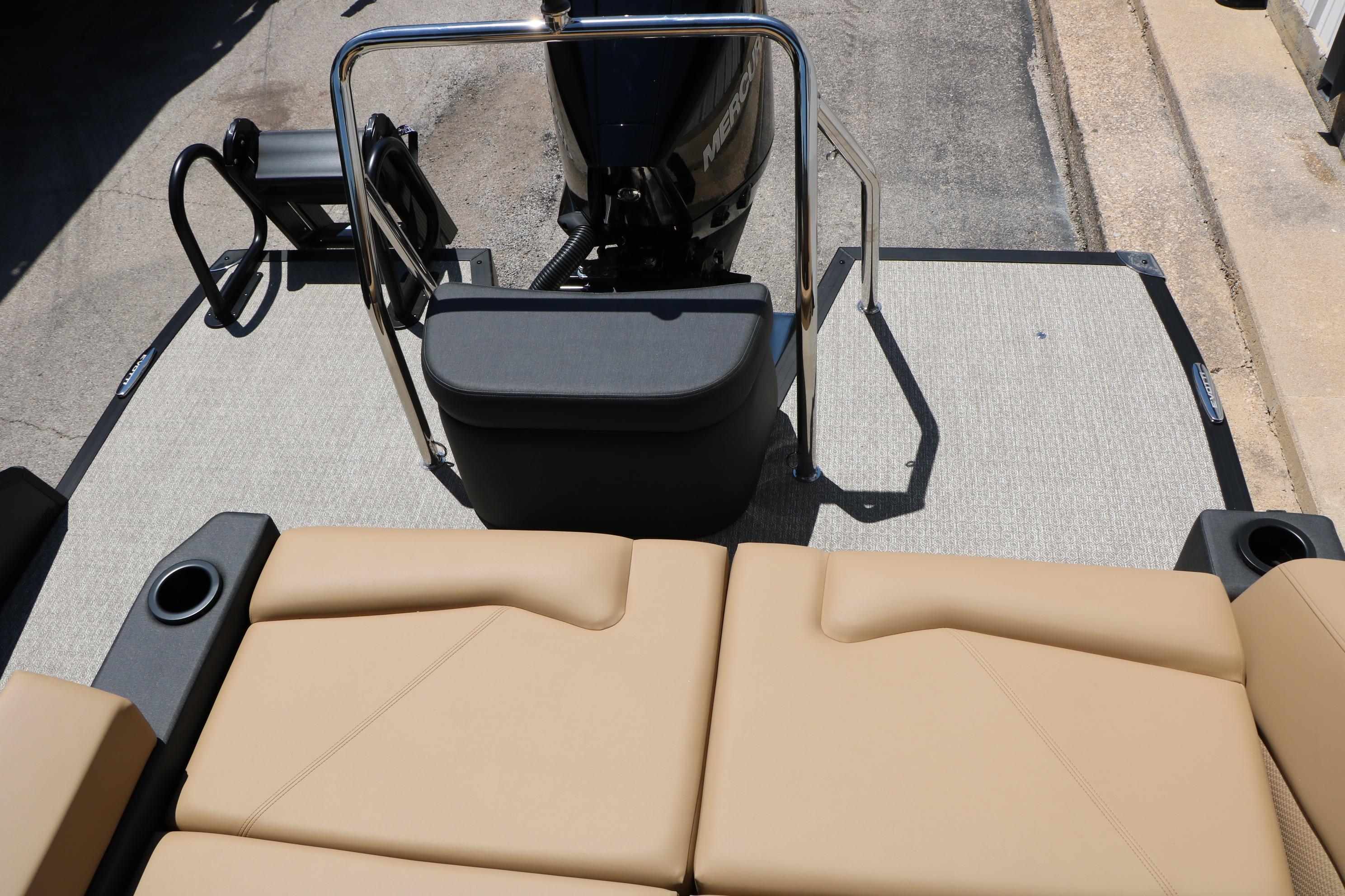 Rear view of 2026 Evotti 521CS boat with tan seating and motor.