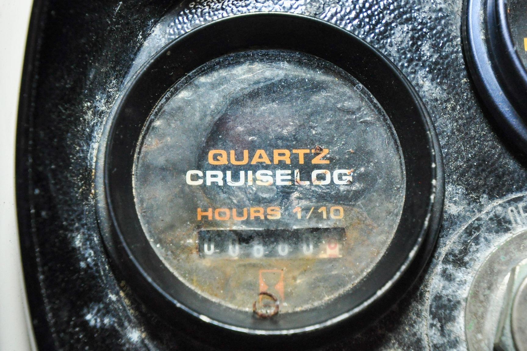Quartz cruiselog gauge on a 1987 Nauset Coastal 27 boat dashboard.