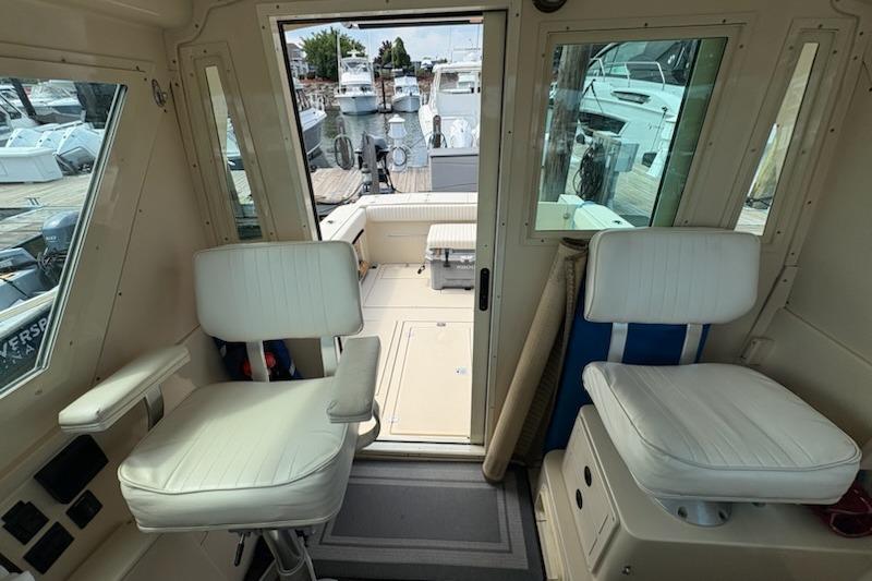 Interior view of a 2003 Albin 28 Tournament Express boat with white seating.
