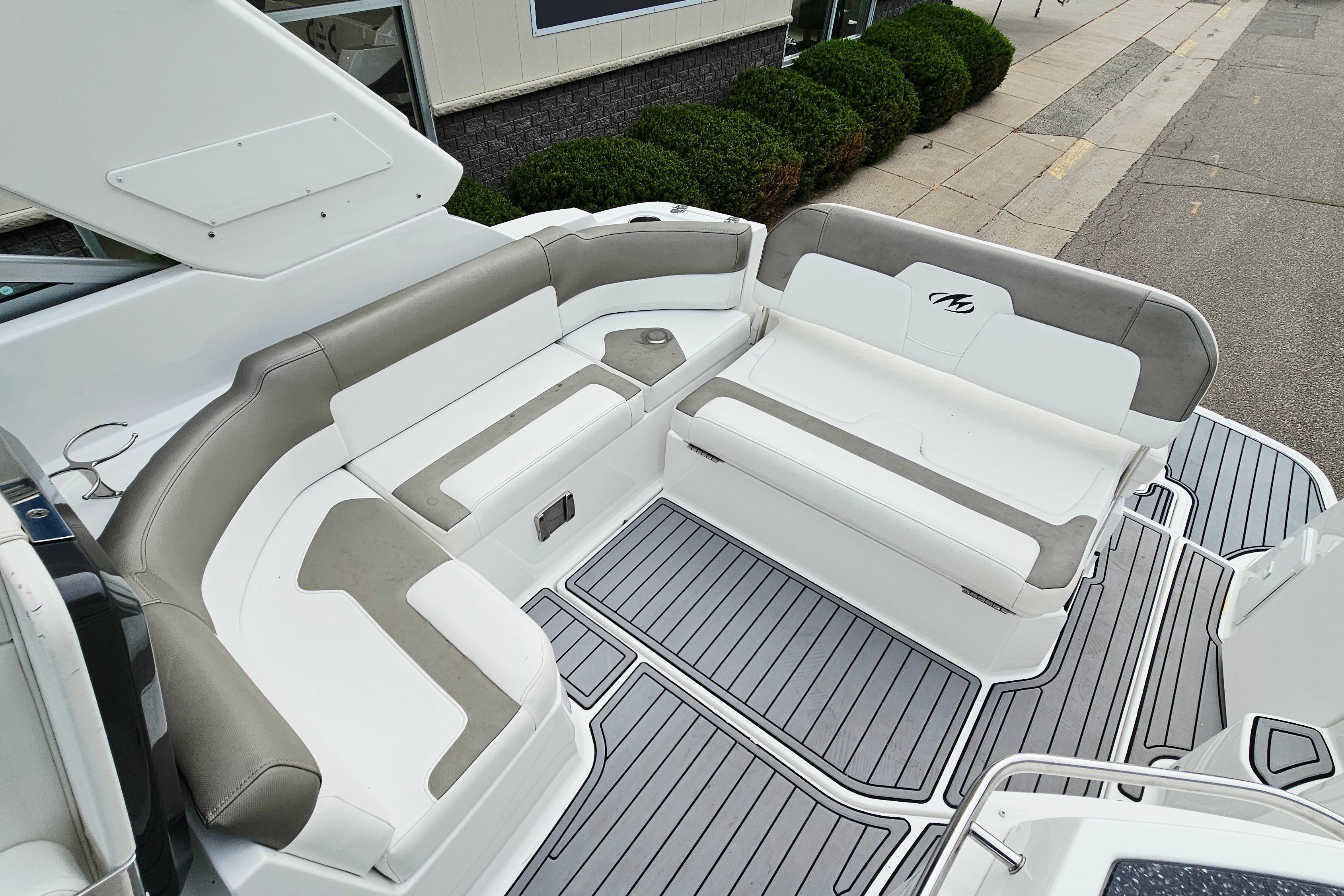 2016 Monterey 295 Sport Yacht interior with sleek seating and modern design.