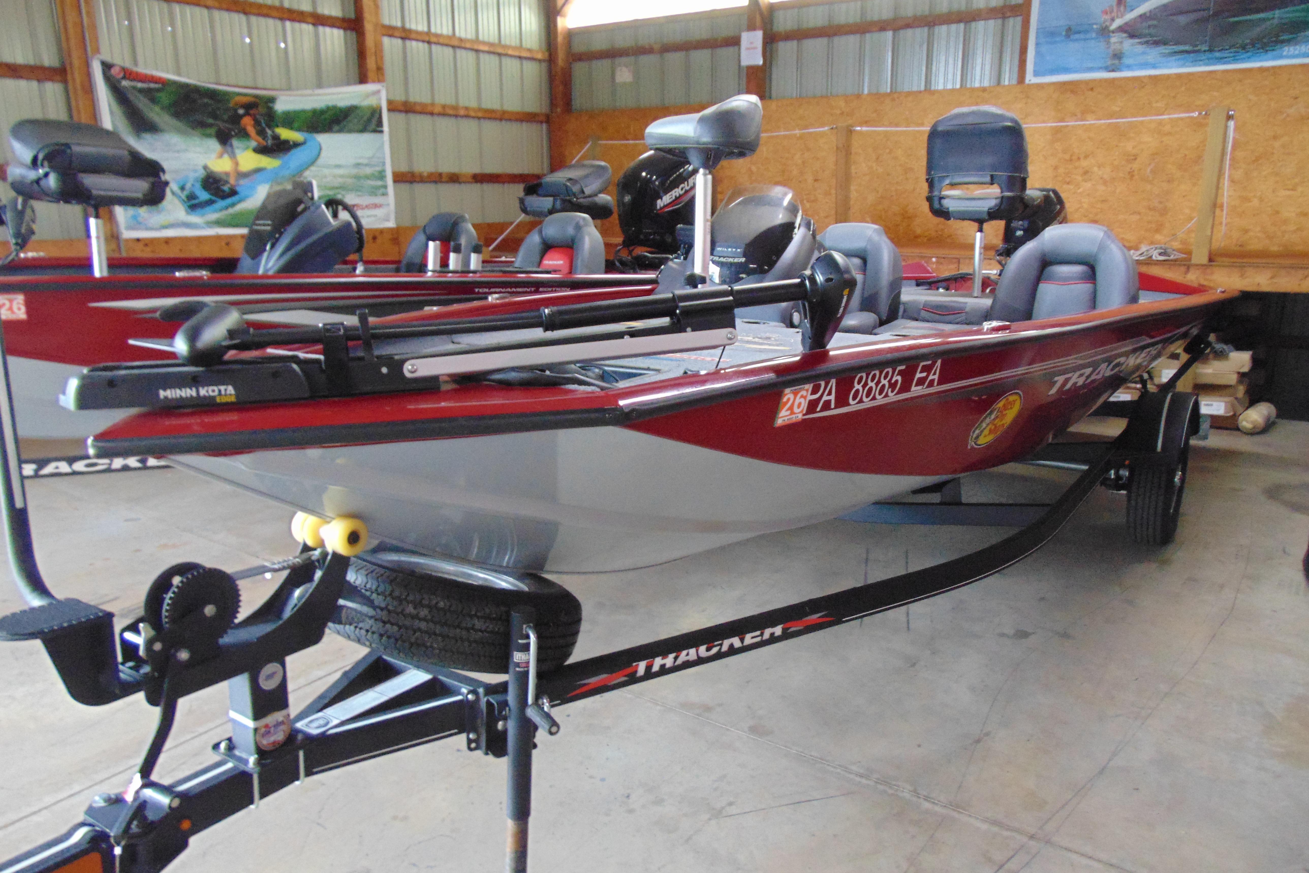 2022 Bass Tracker Pro 17 boat in a garage, featuring Minn Kota trolling motor.