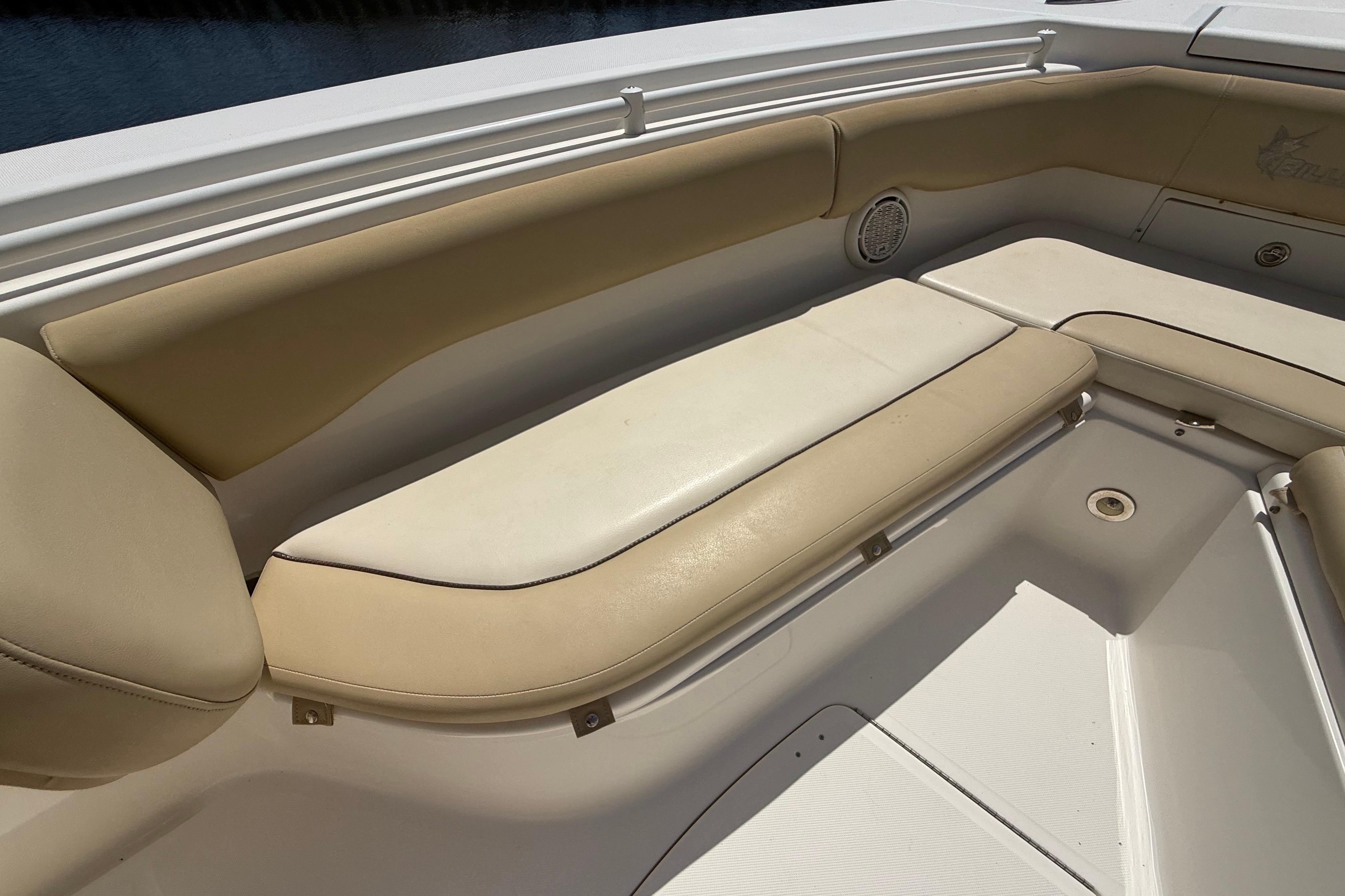 2019 Key West Billistic 281 Center Console boat with beige seating area.