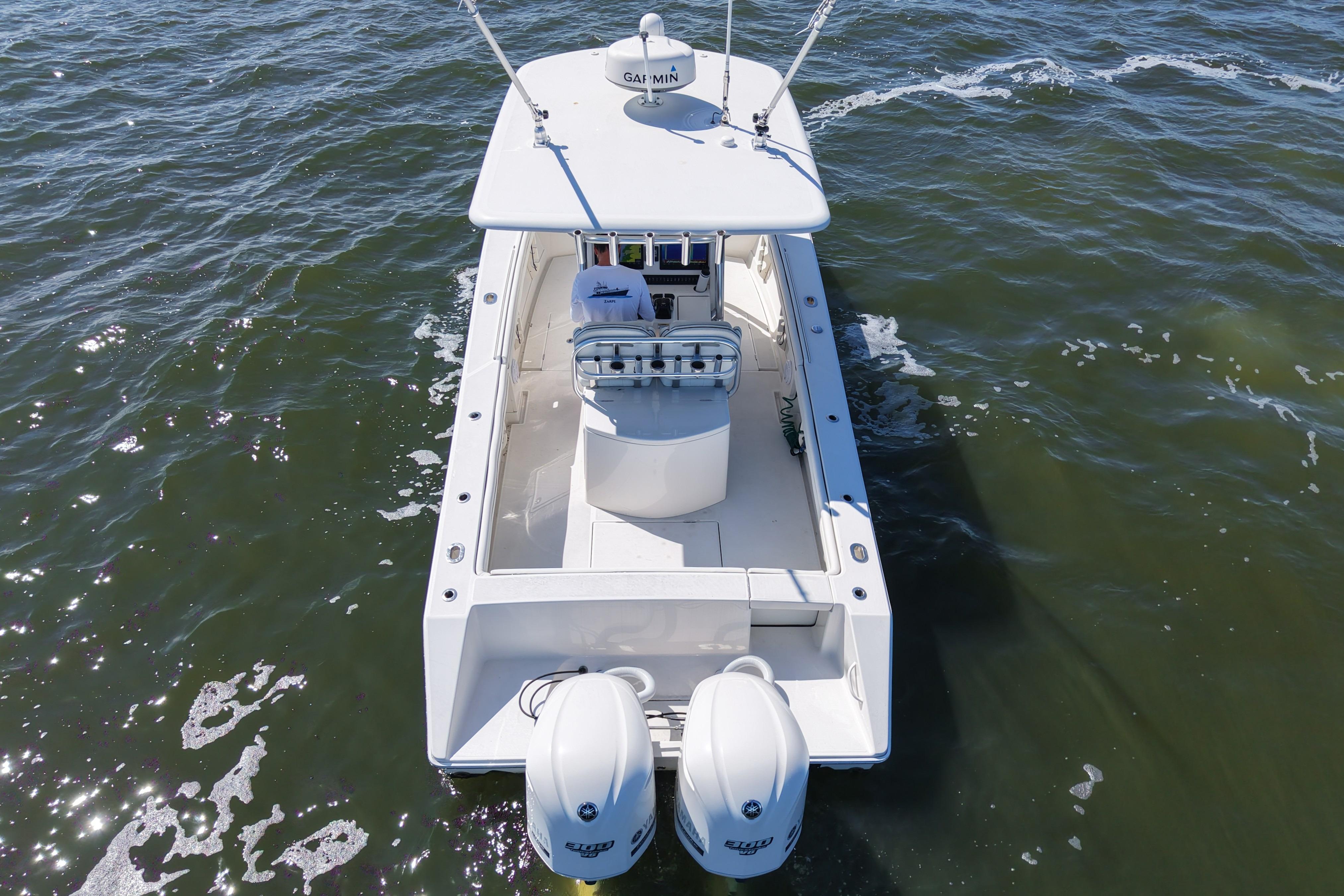 2014 Jupiter 30 FS boat on water, aerial view, twin engines visible.