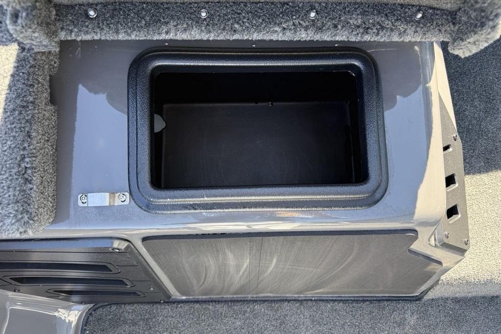 Storage compartment in 2026 Skeeter ZX150 boat, featuring a sleek, carpeted interior design.
