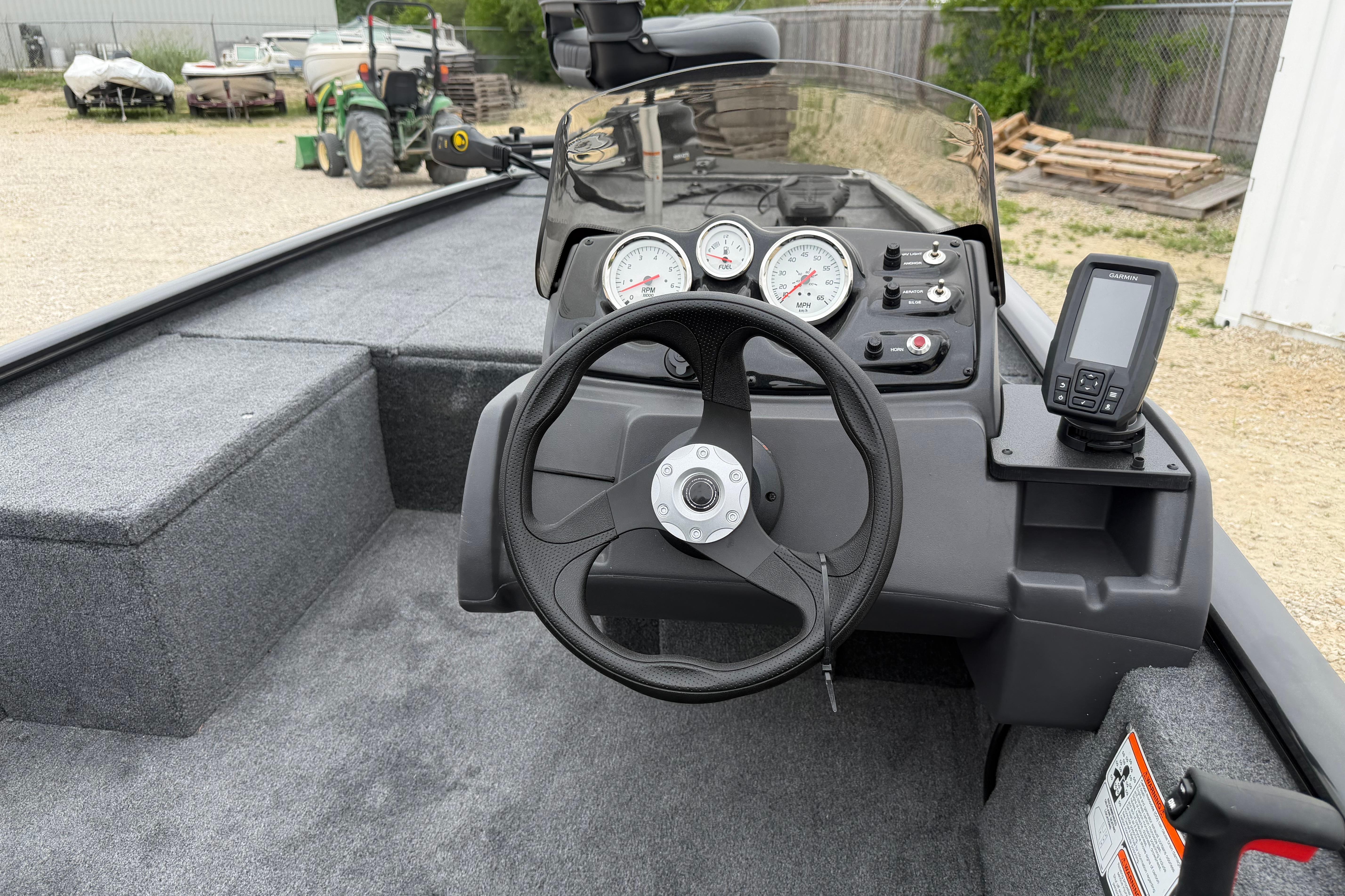 2026 Tracker Pro 170 boat dashboard with steering wheel and gauges.