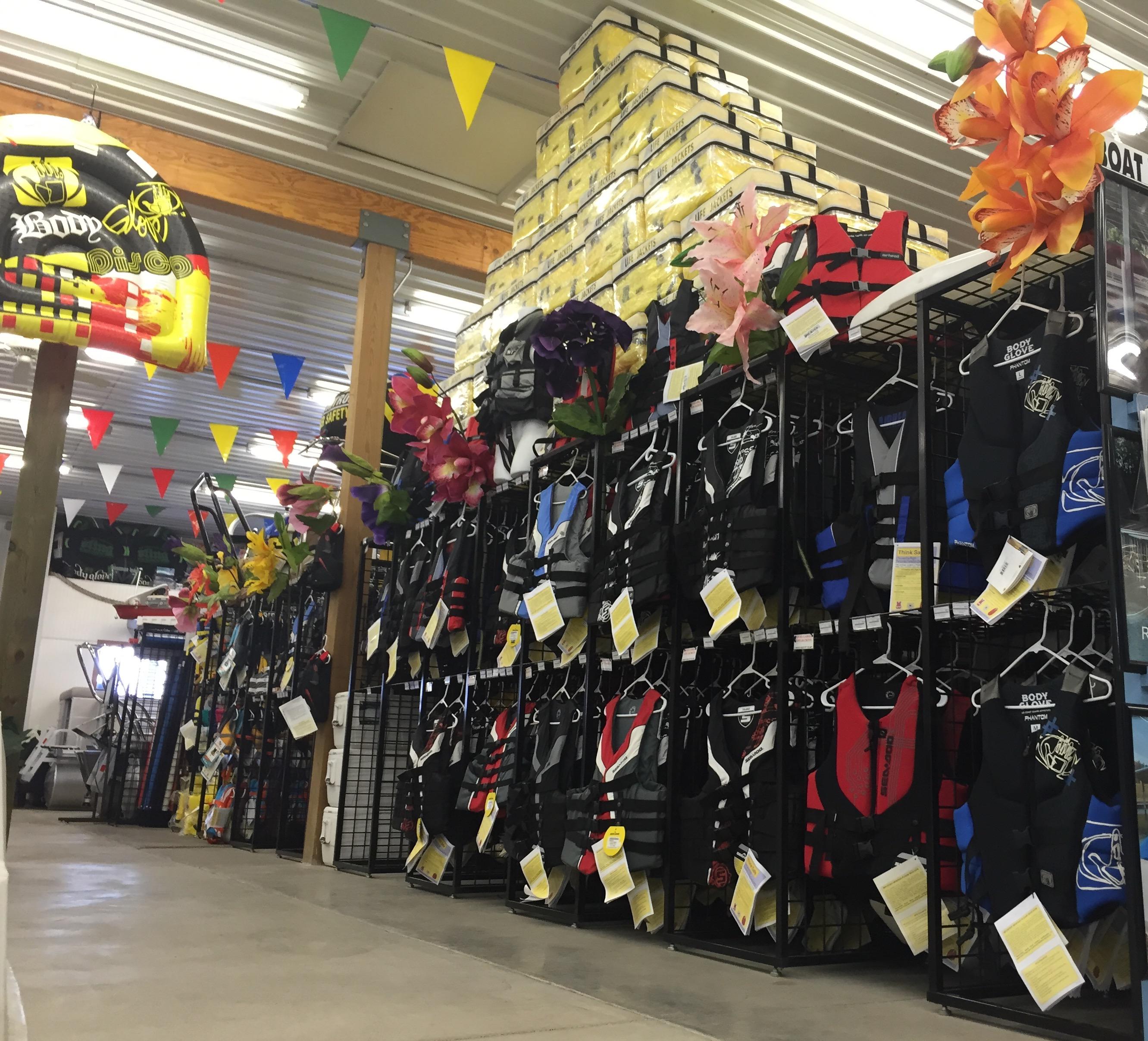 Store interior with colorful life jackets and decorations, showcasing Sylvan Mirage 8520 LZ, 2025 model.