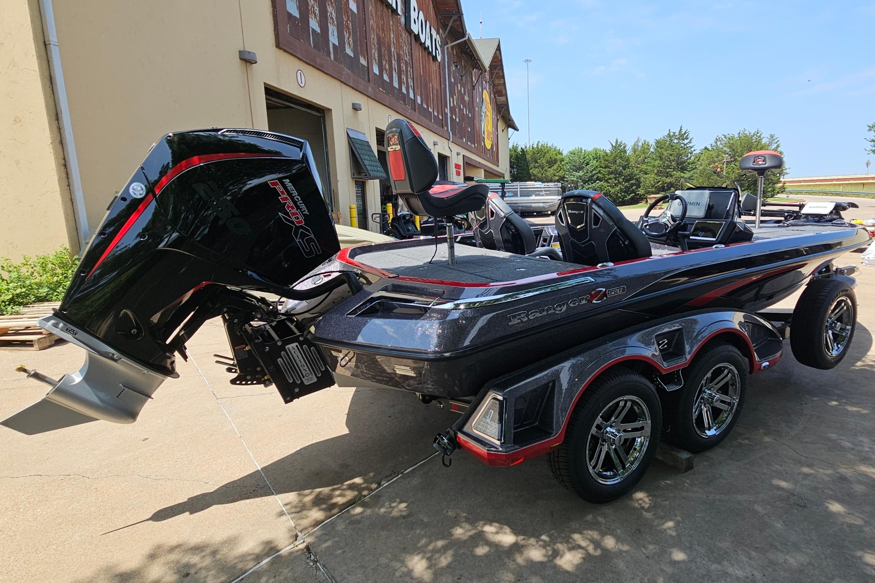 2026 Ranger Z520R bass boat with powerful outboard motor, parked outdoors.