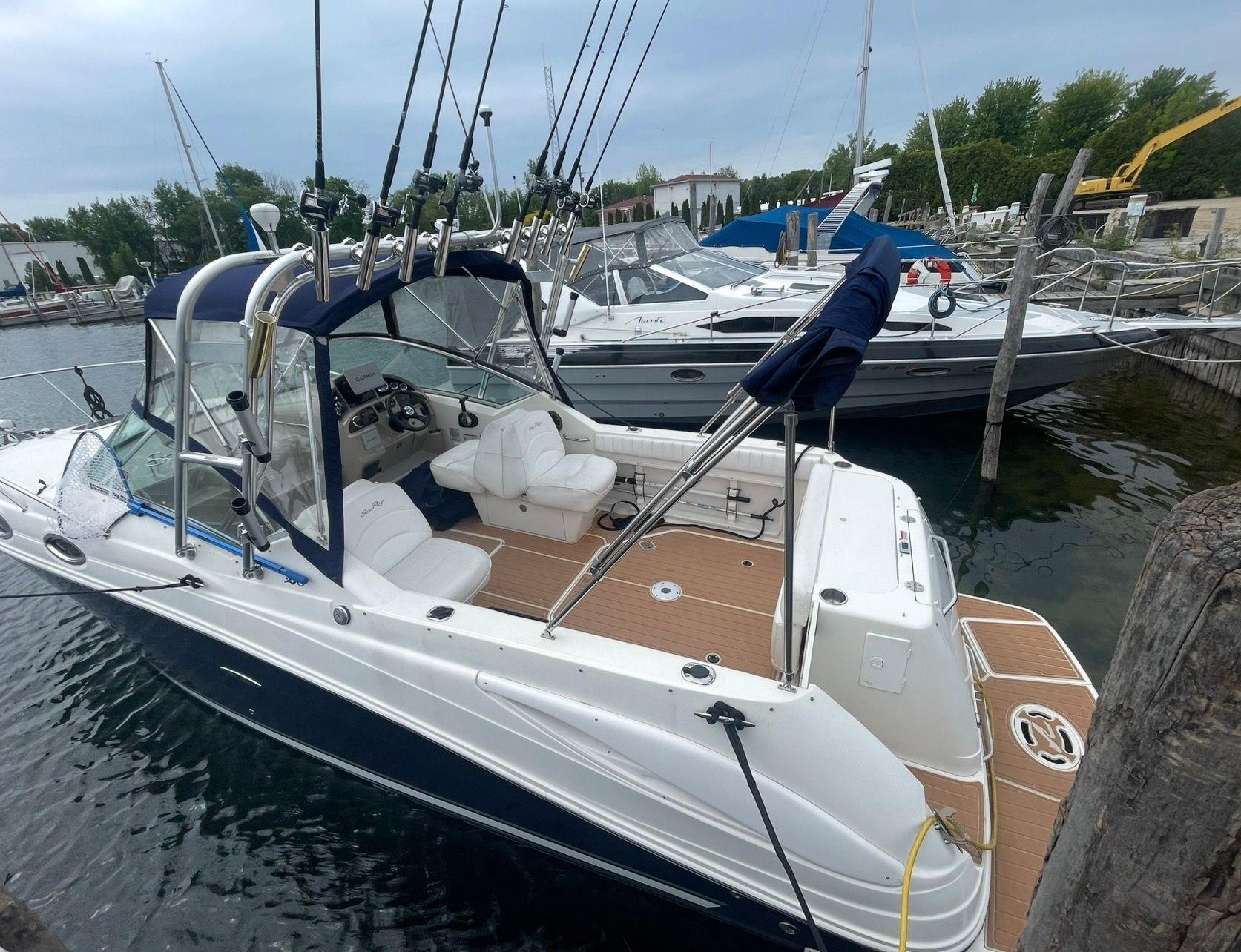 2006 Sea Ray 270 Amberjack boat docked at marina.