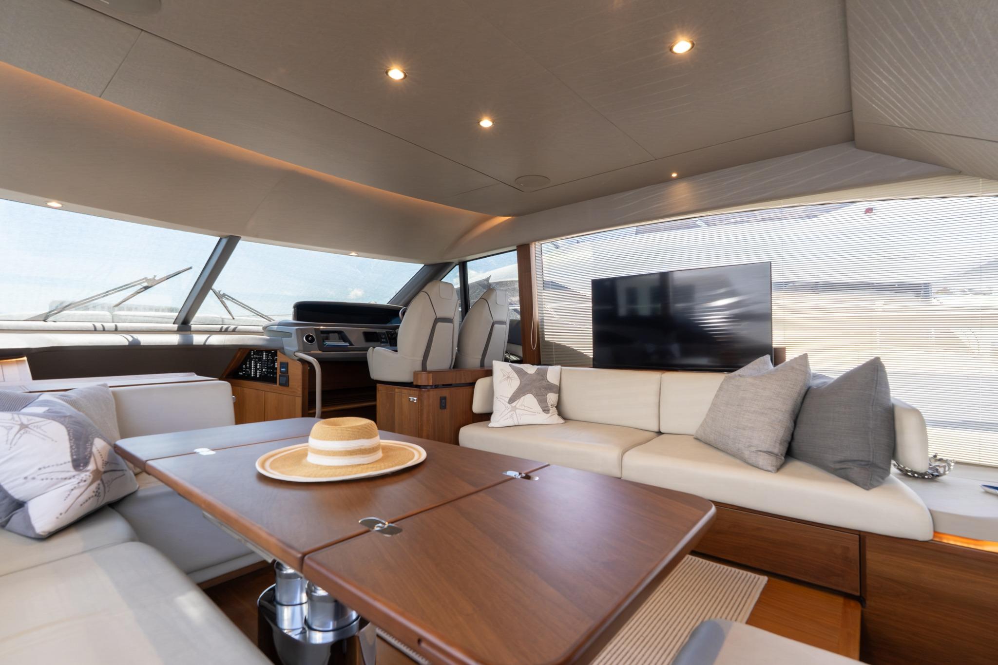 Luxurious interior of 2021 Princess F55 yacht with elegant seating and modern decor.