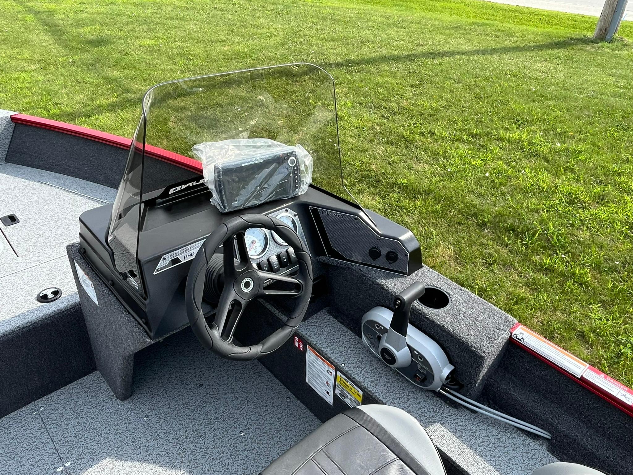 2026 Lund 1650 Angler SS boat interior with steering wheel and control panel.