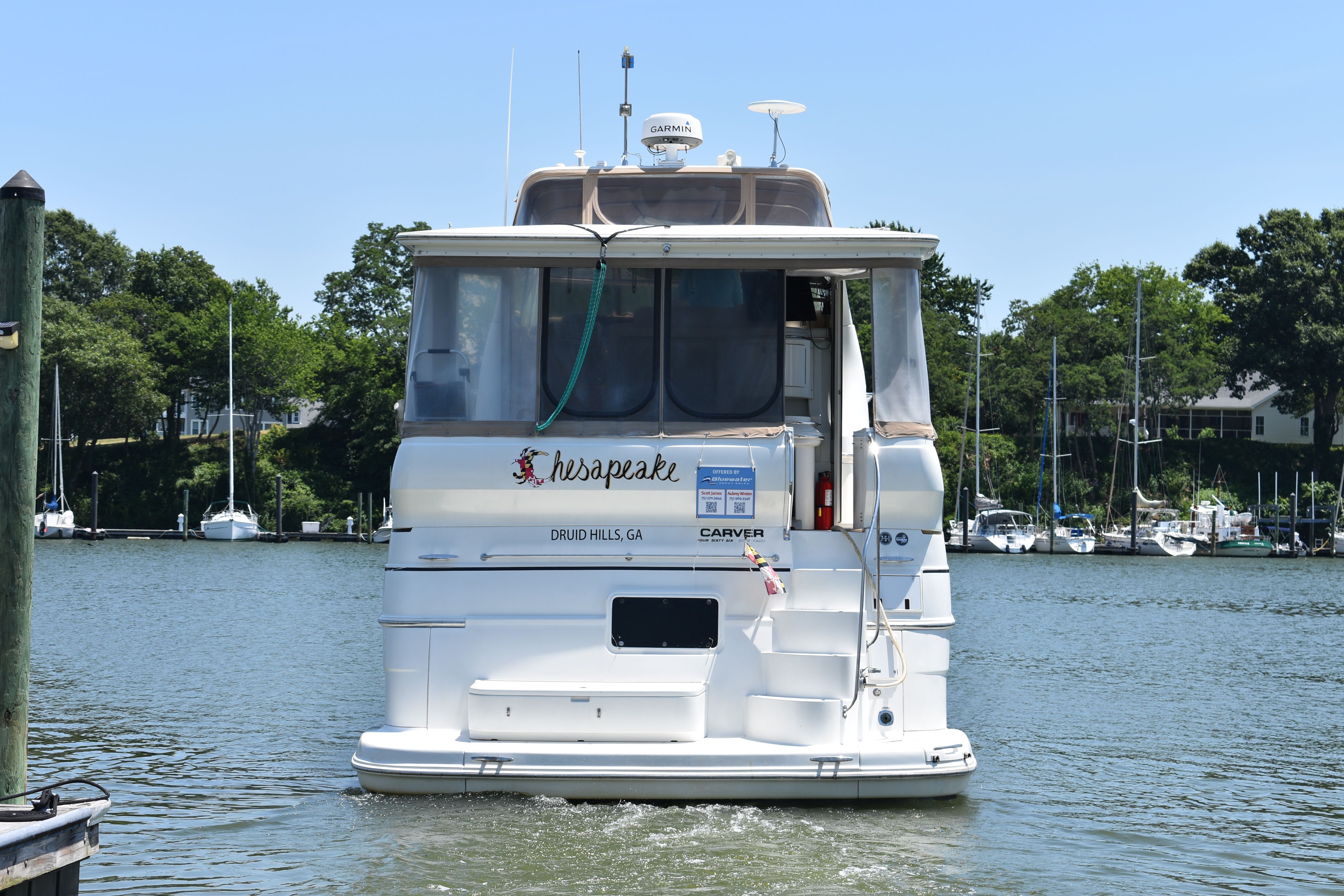 A 2004 Carver 466 Motor Yacht cruising on calm waters.