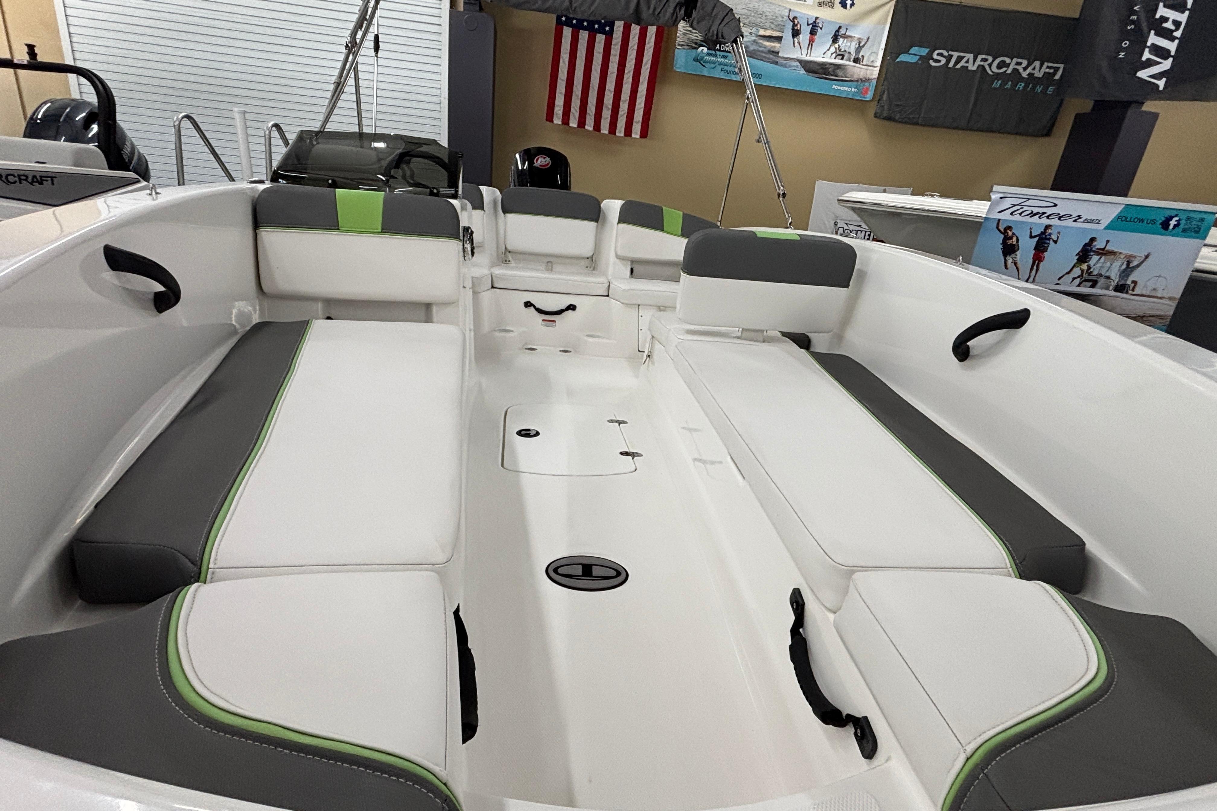 2024 Tahoe T18 boat interior with gray and green seating, showcasing spacious design.