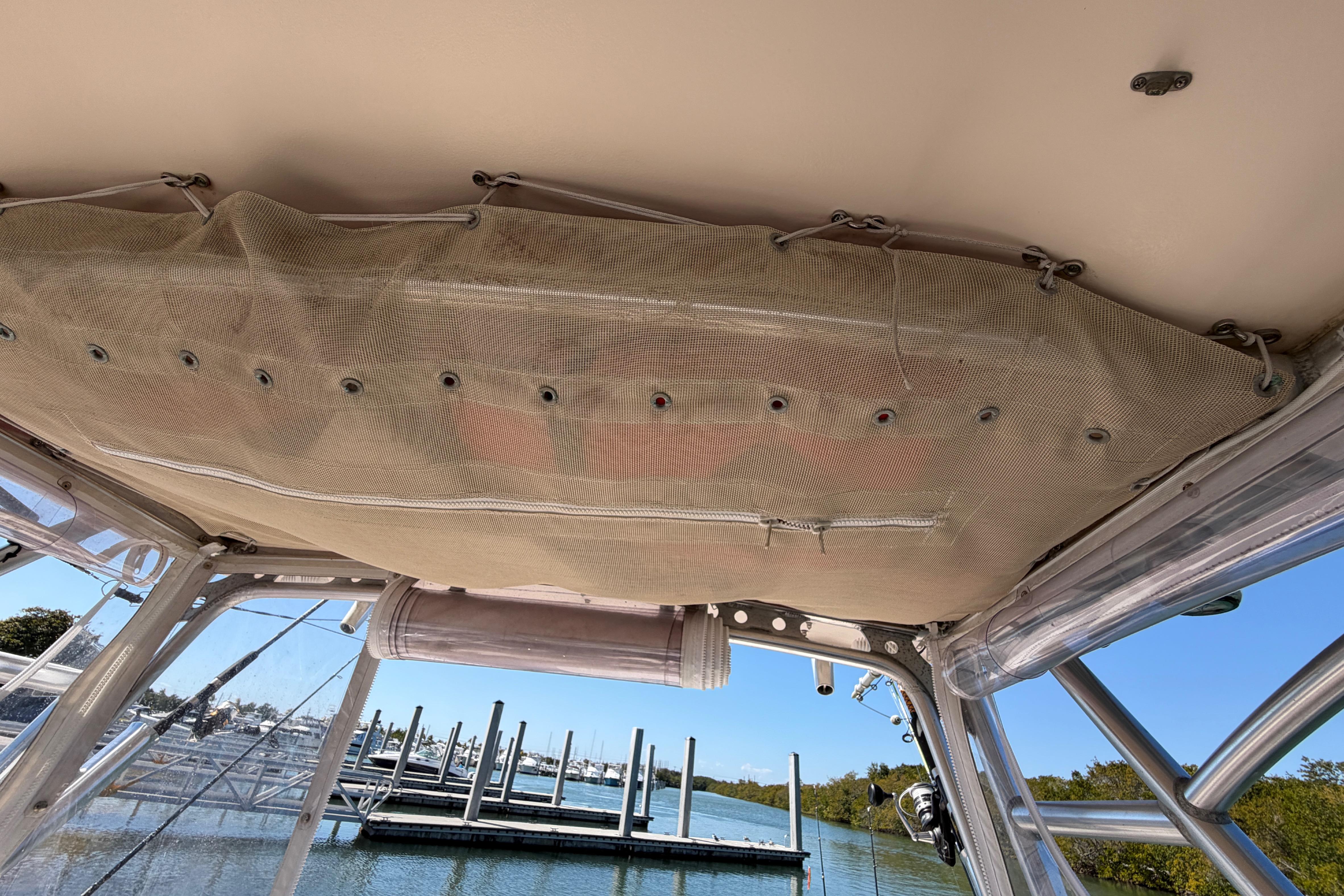 2006 Grady-White Sailfish 282 boat interior with netting and dock view.