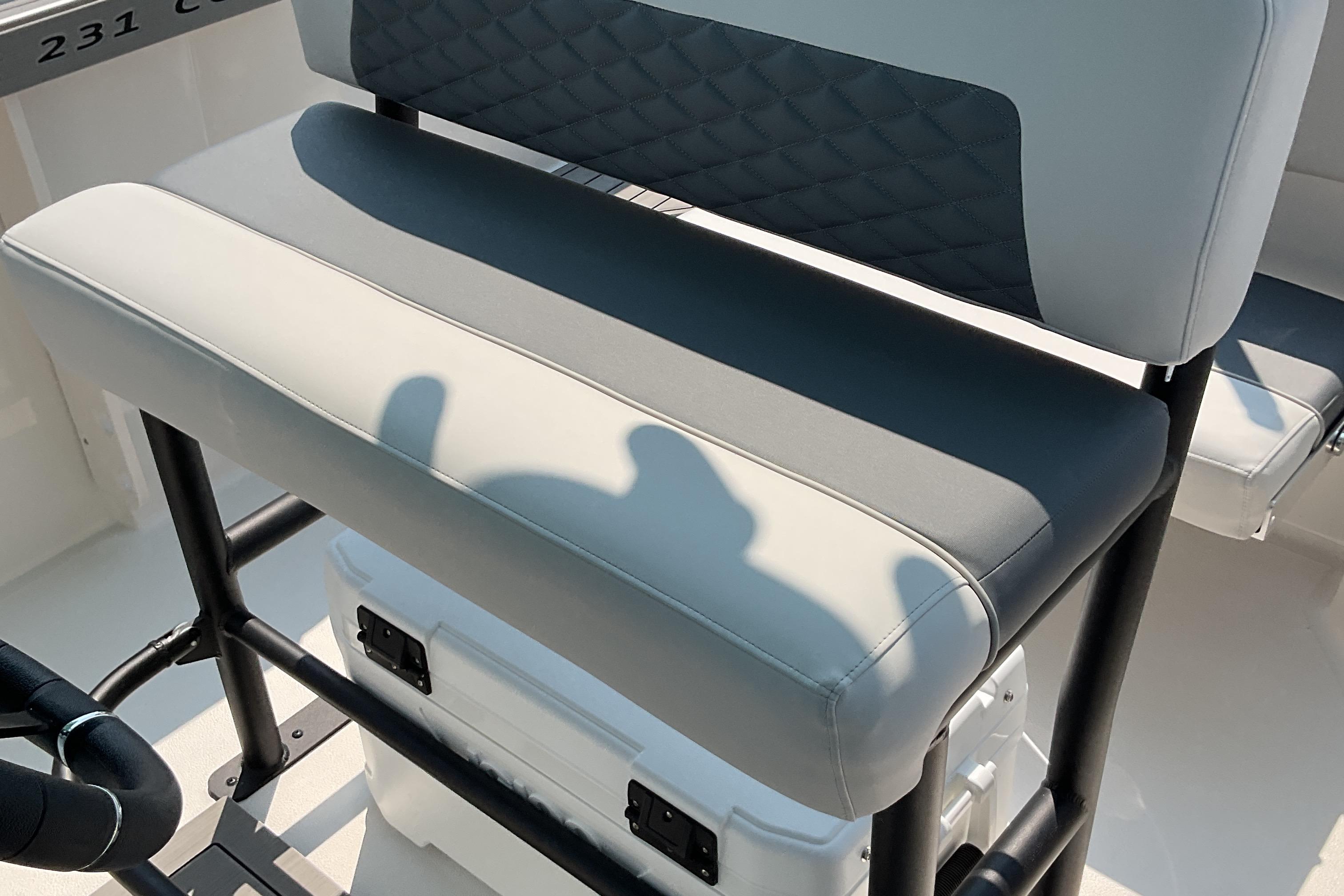 2026 Starcraft SVX 231 OB CC boat seat with black frame and white cushion.