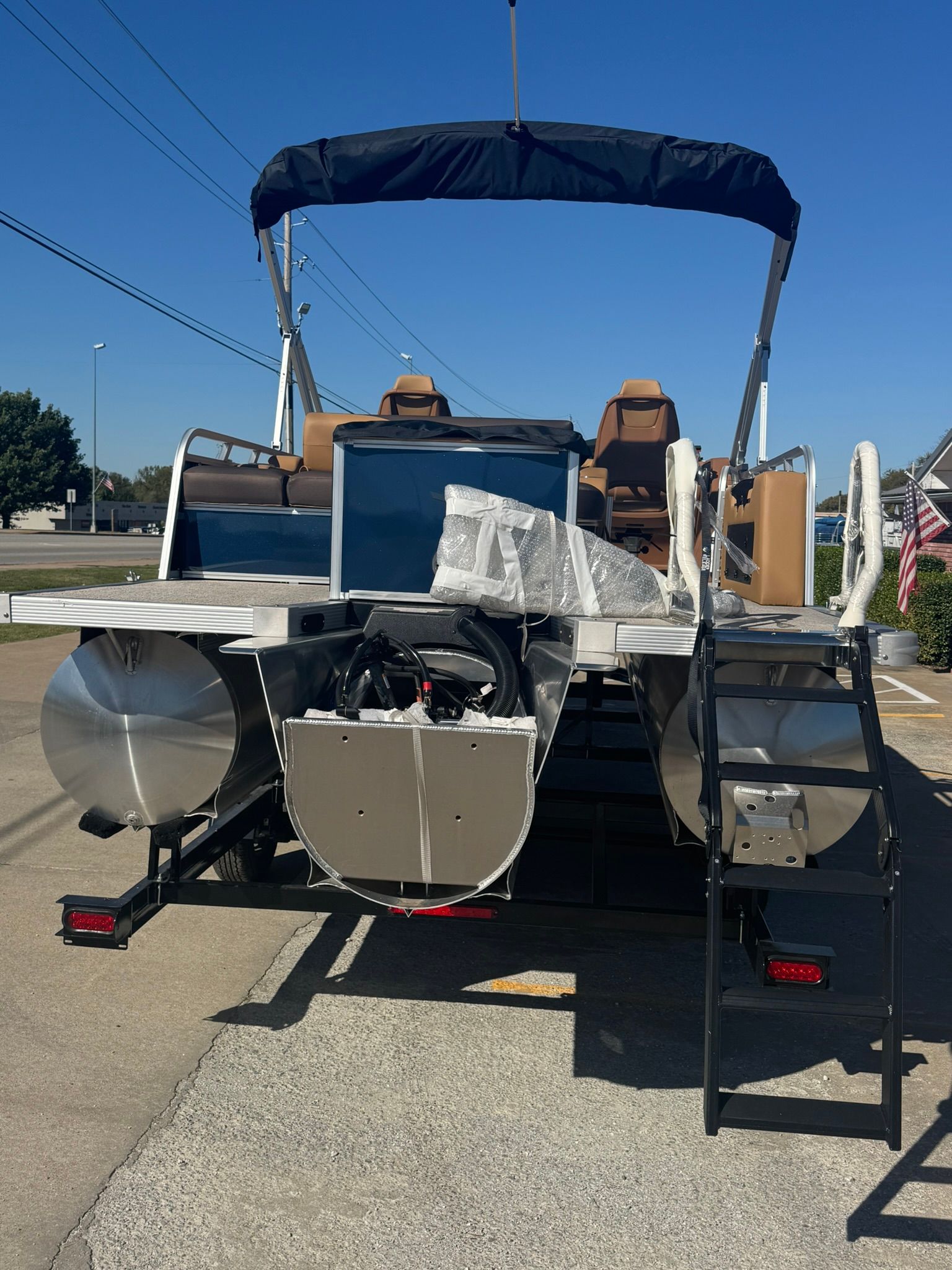 2025 Tahoe 2585 LTZ VRB pontoon boat on trailer, rear view.