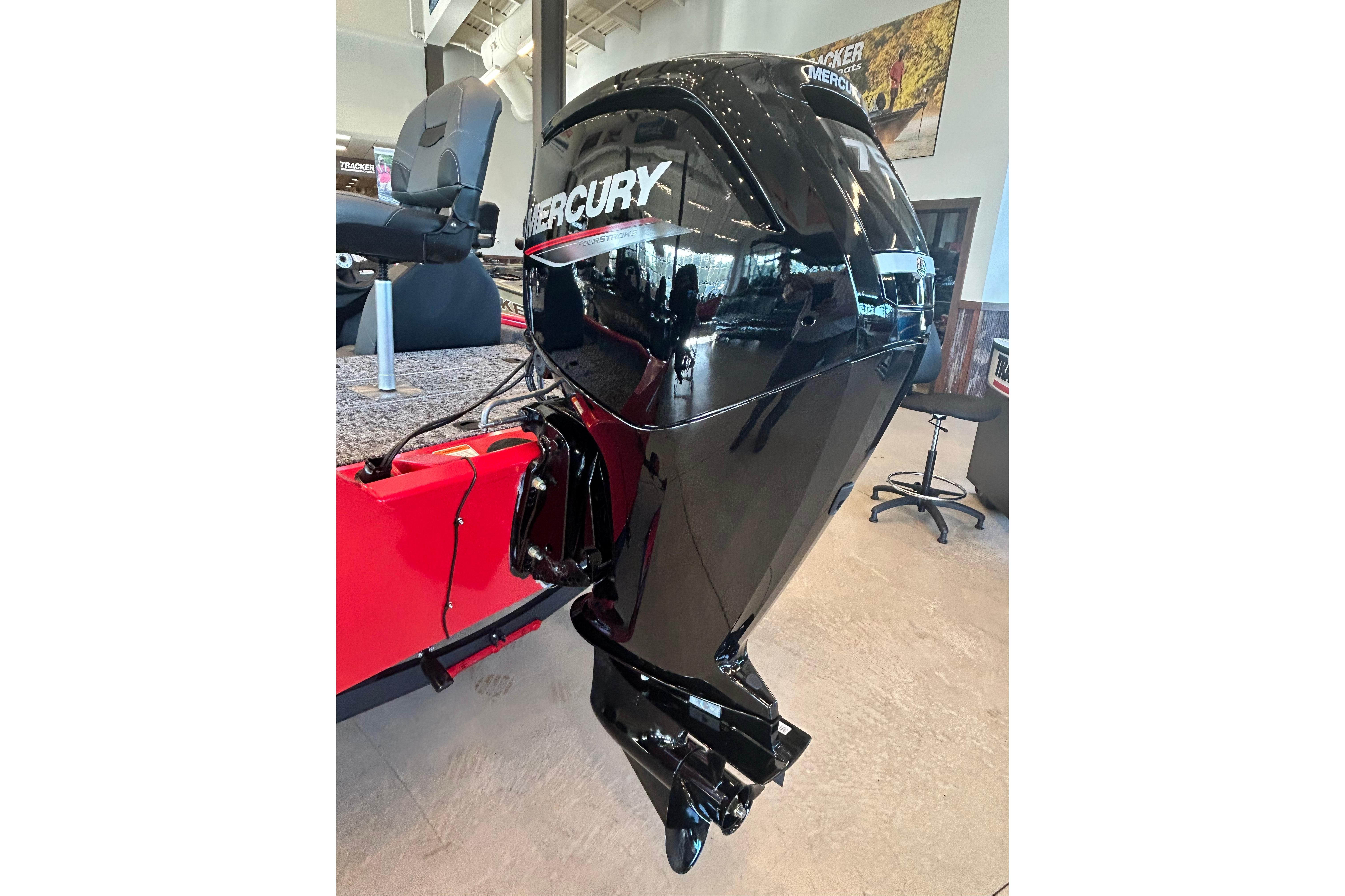 2026 Tracker Pro Team 175 with Mercury outboard motor in showroom.