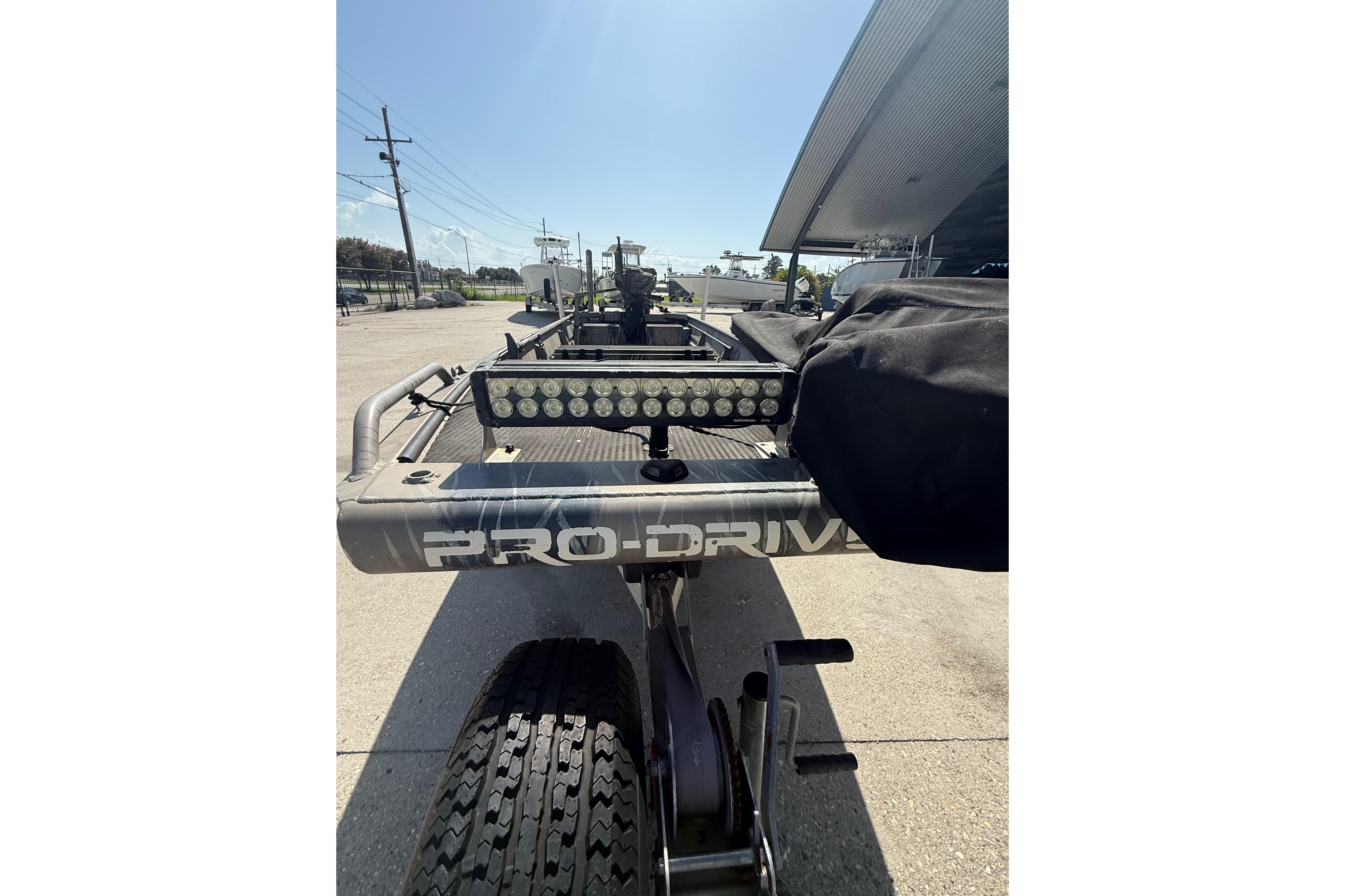 2017 Pro-Drive 2048 boat trailer with light bar, parked outdoors.