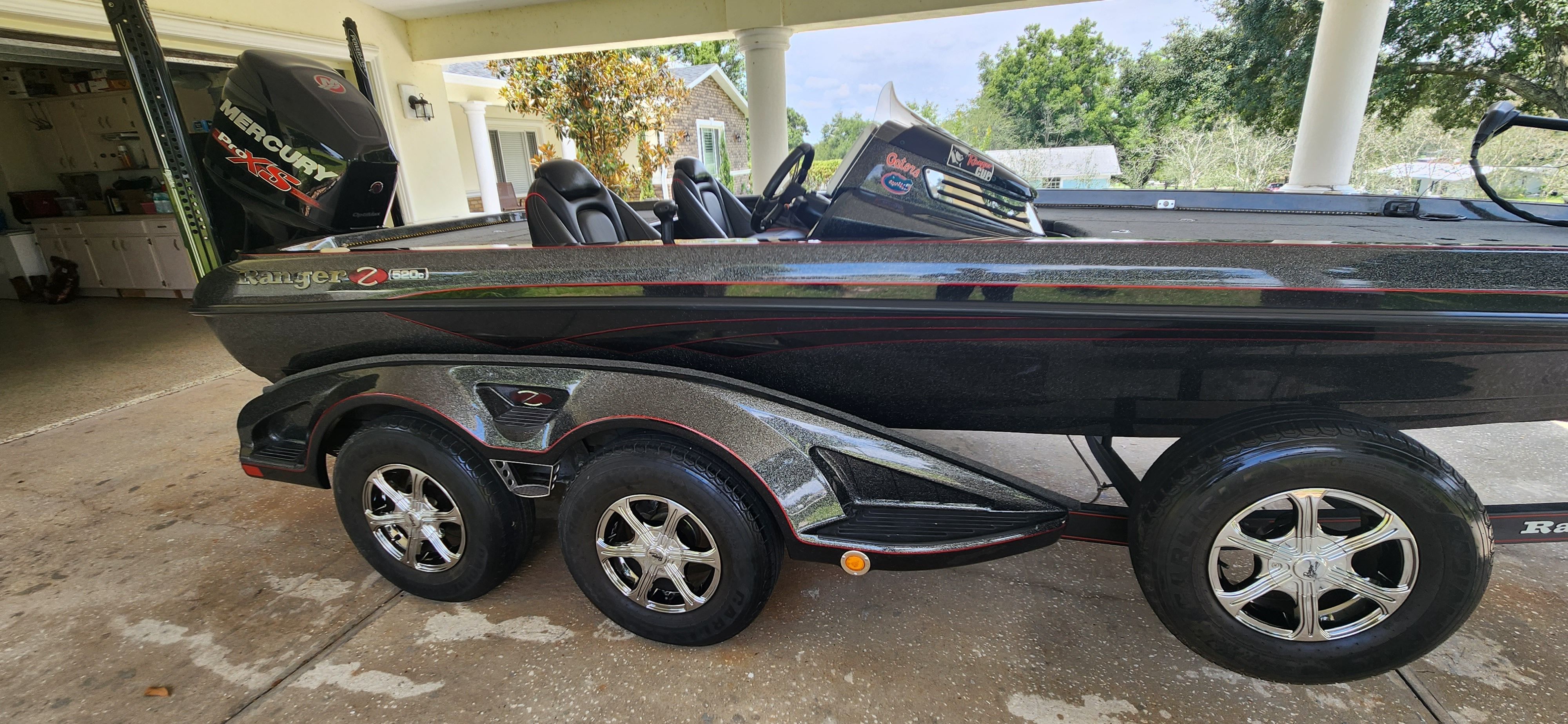 A 2017 Ranger Z520 Comanche boat on a trailer in a garage.
