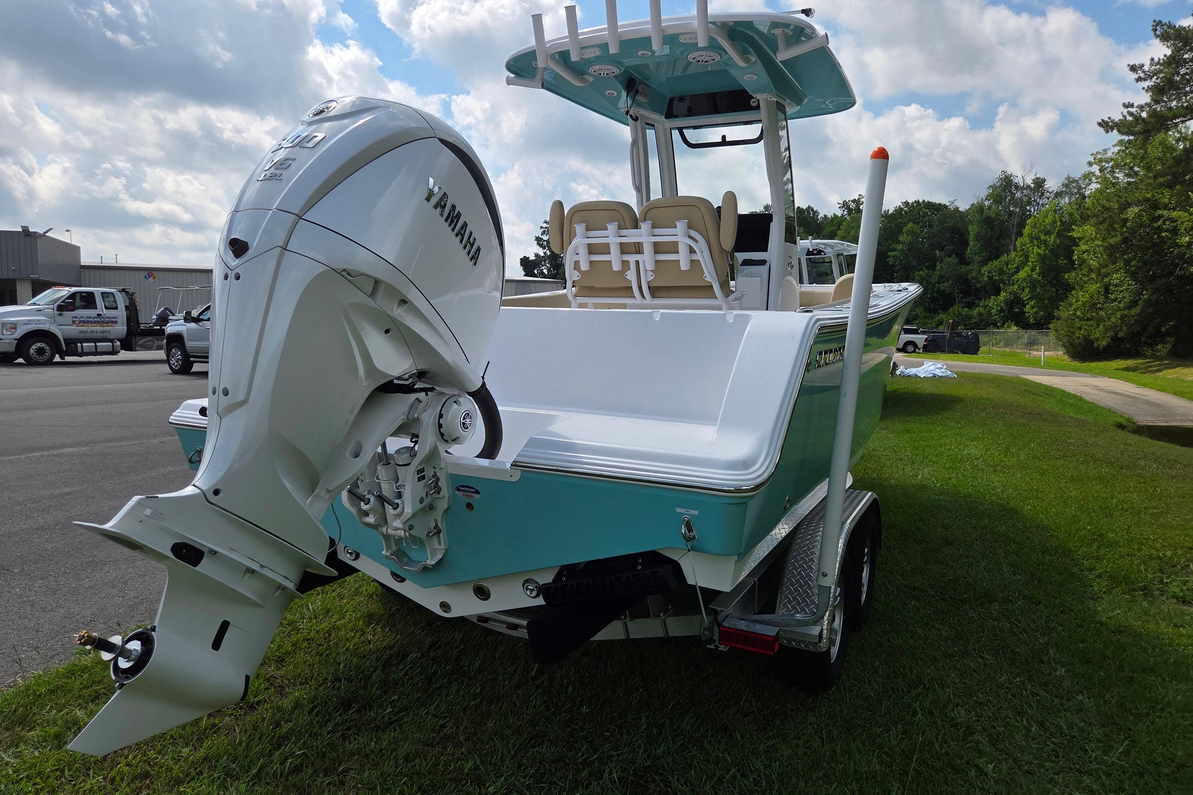 2026 Sportsman Open 232 Center Console boat with Yamaha outboard motor on trailer.