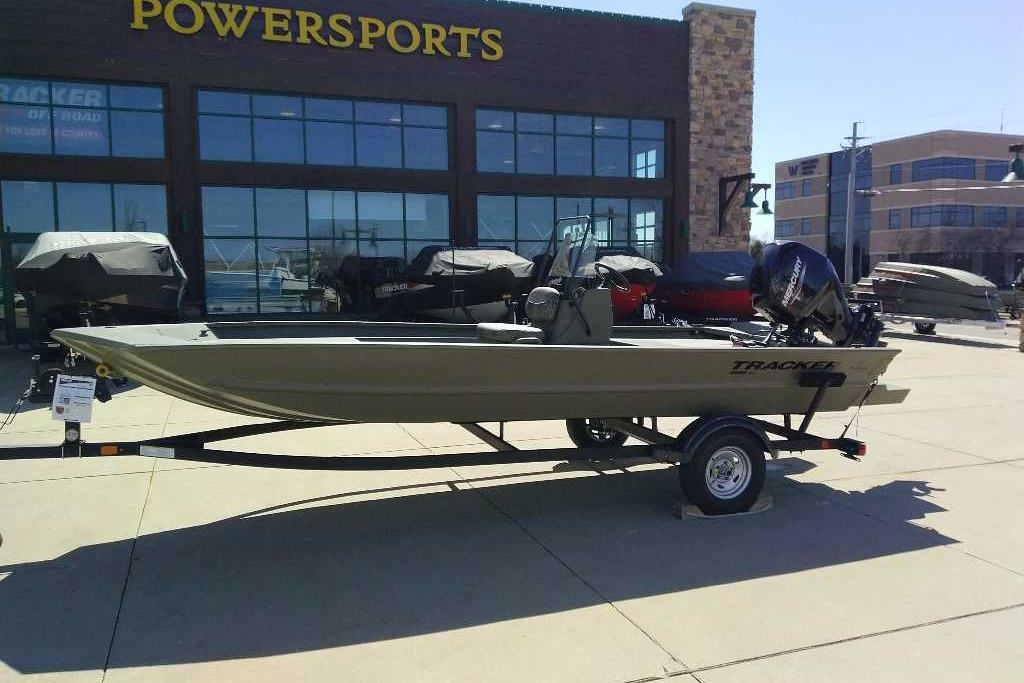 2026 Tracker Grizzly 1860 CC boat displayed outside Powersports dealership.