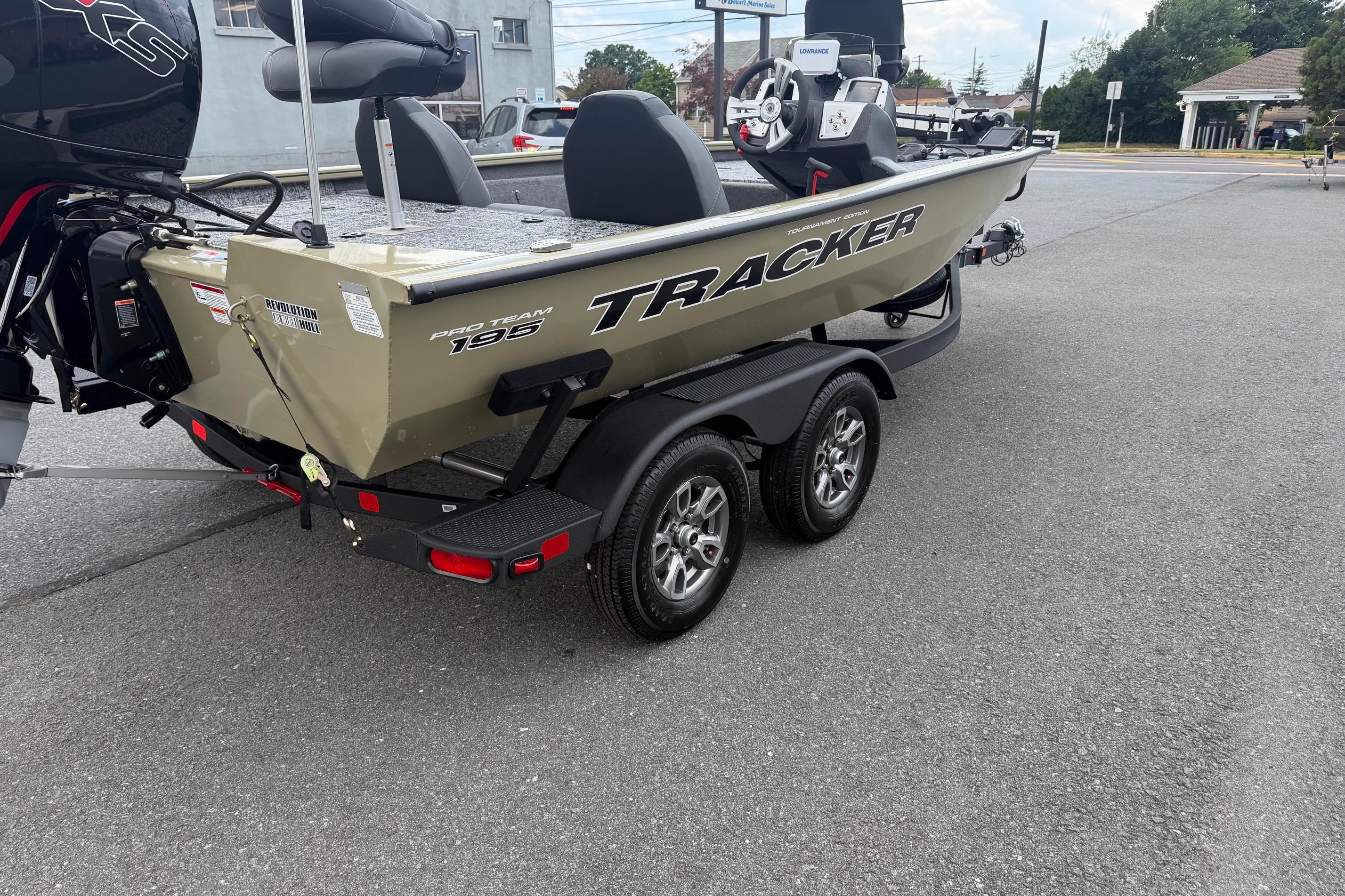 2026 Tracker Pro Team 195 boat on trailer, parked outdoors.