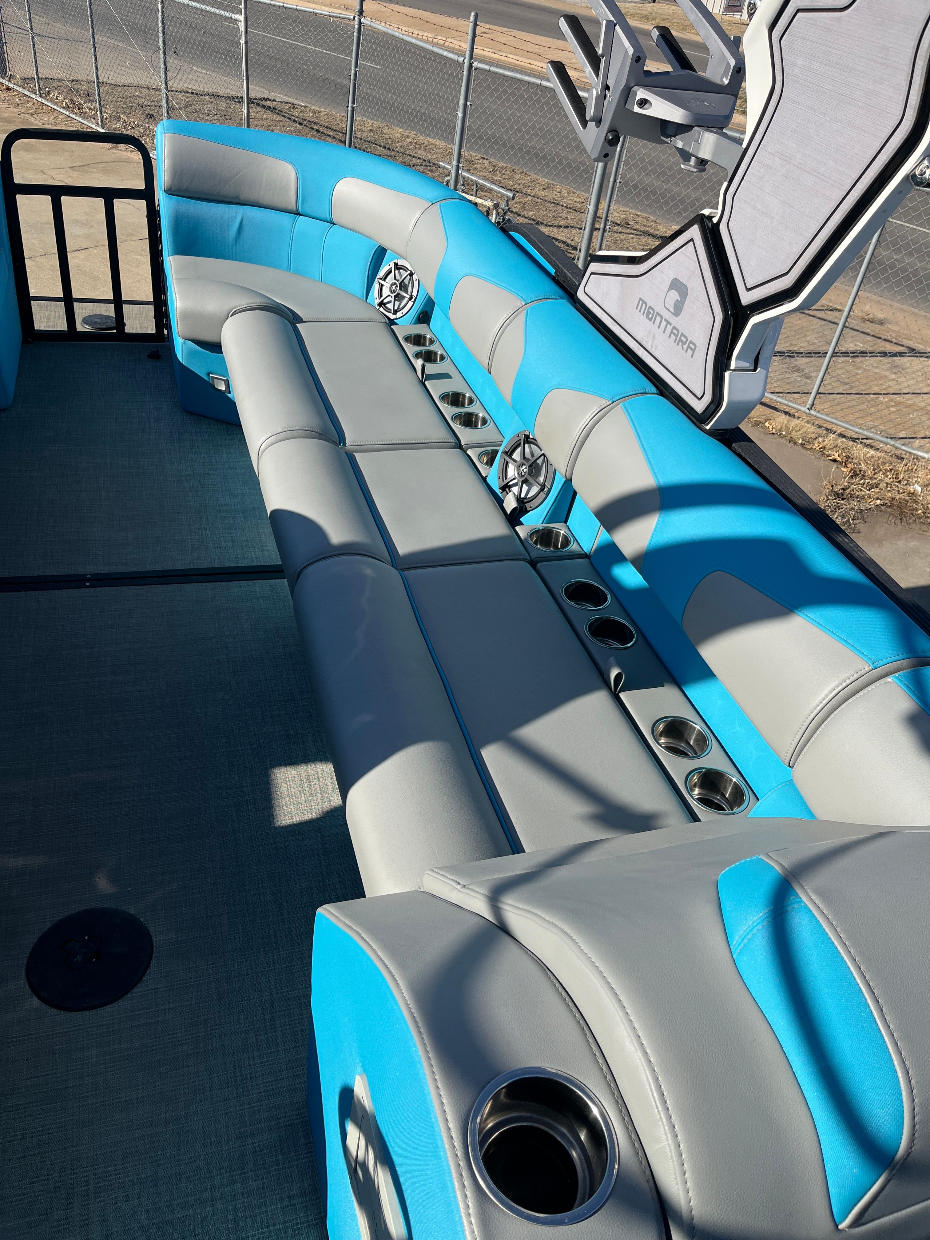 Interior of 2023 Montara Surf Boss 2.0 boat with blue and gray seating.