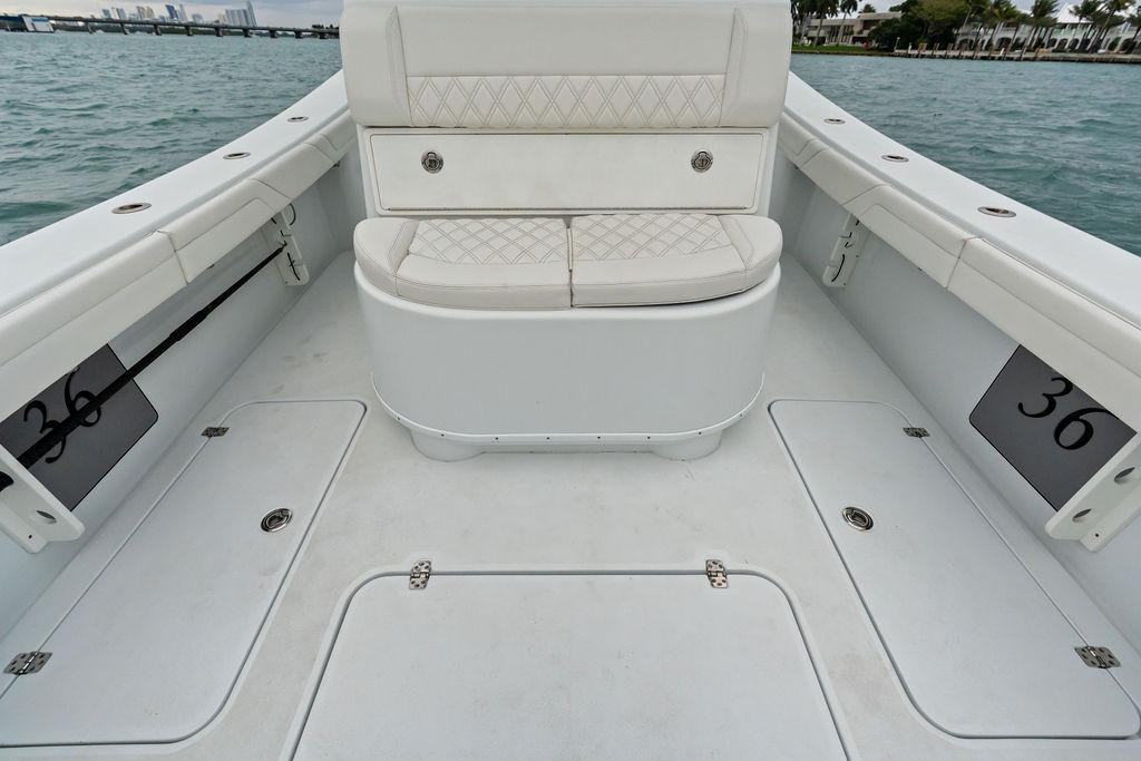 2021 Yellowfin 36 Offshore boat interior with cushioned seating and storage compartments.