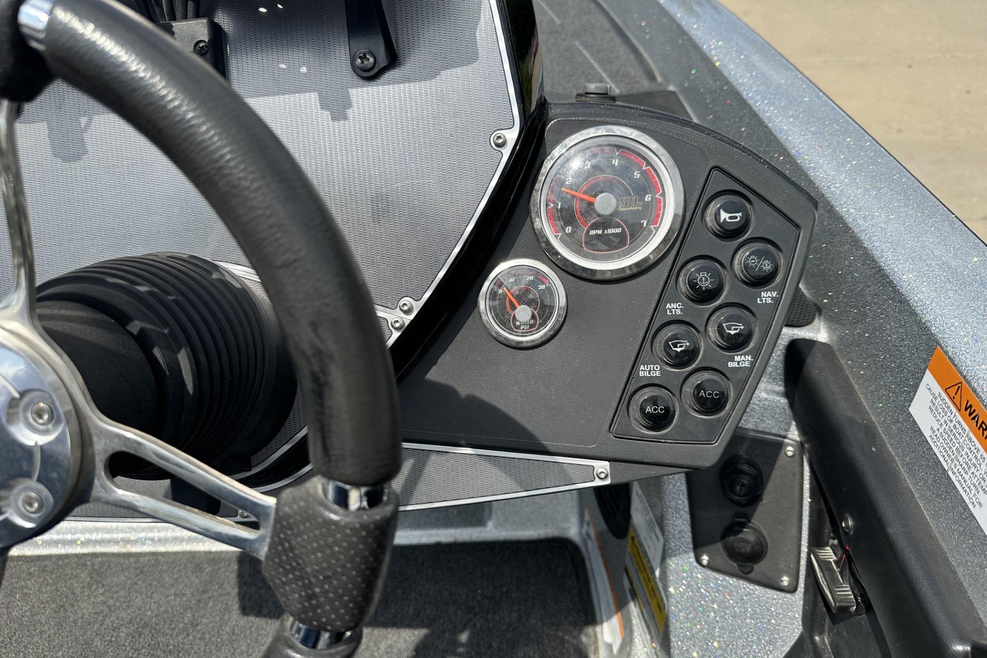Dashboard of a 2018 Ranger Z518 boat with steering wheel and control panel.
