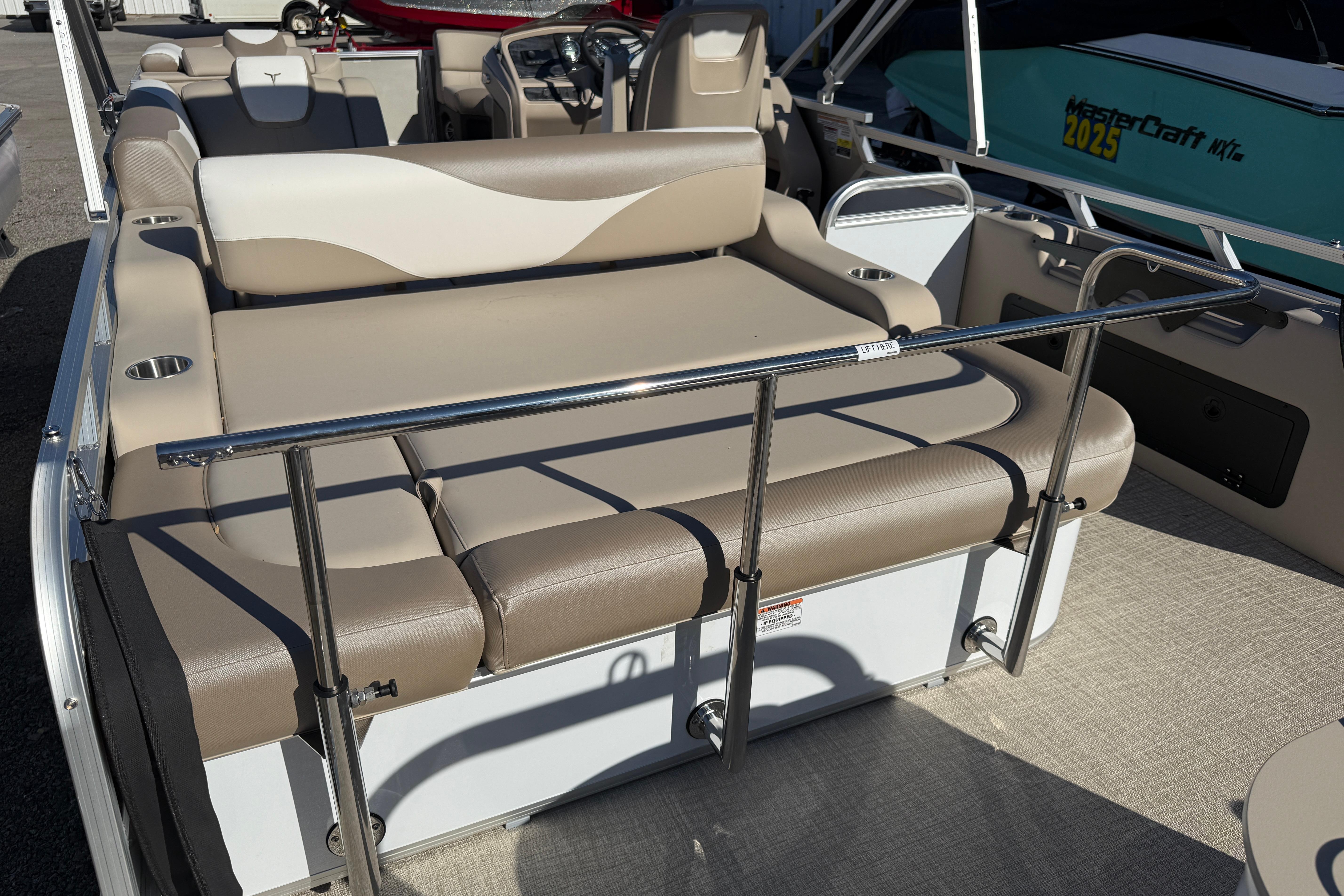 2026 Tahoe Pontoon LTZ Versatile Rear Lounger with beige seating and stainless steel railings.