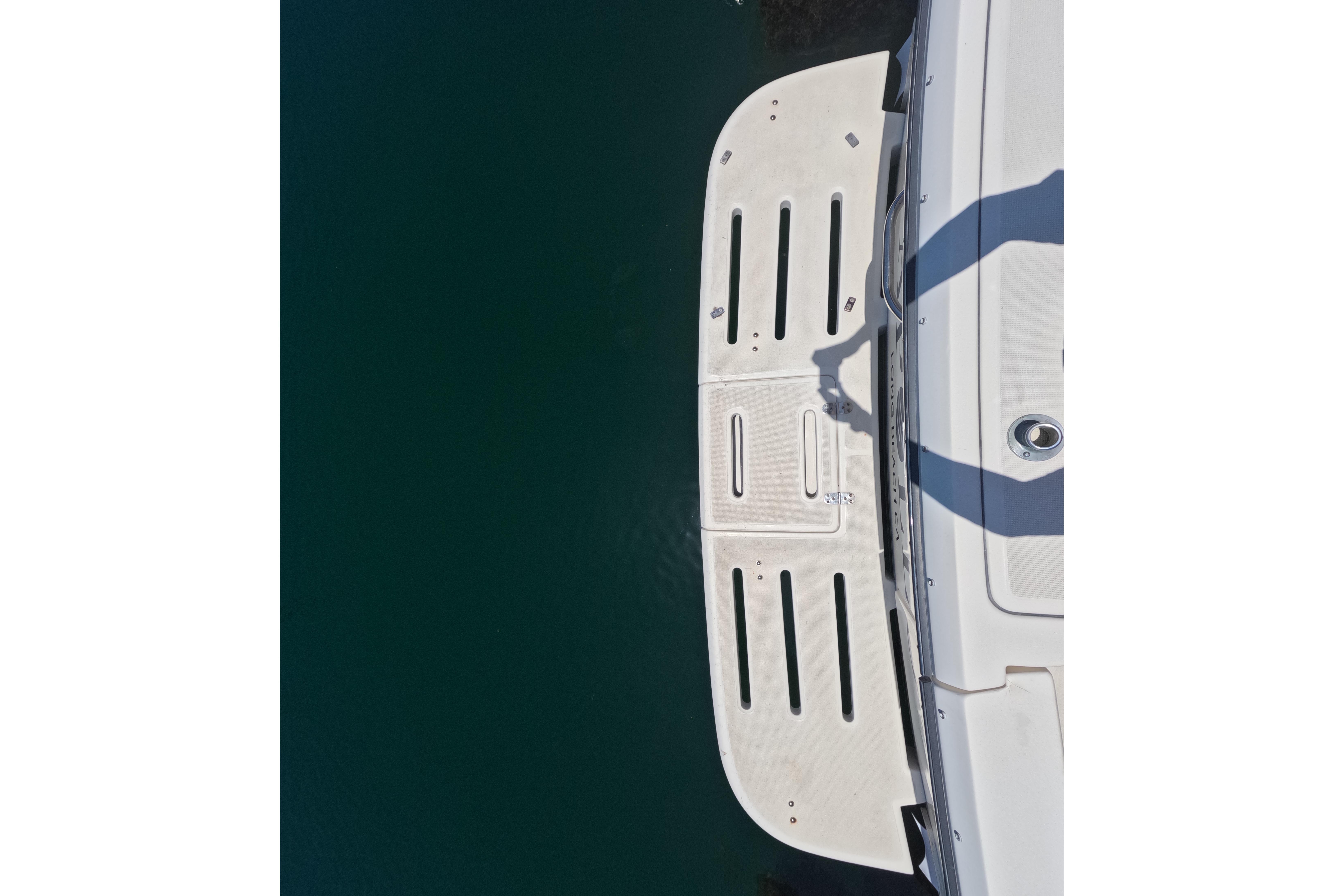Overhead view of 1995 Tiara Yachts 2900 Open swim platform on calm water.