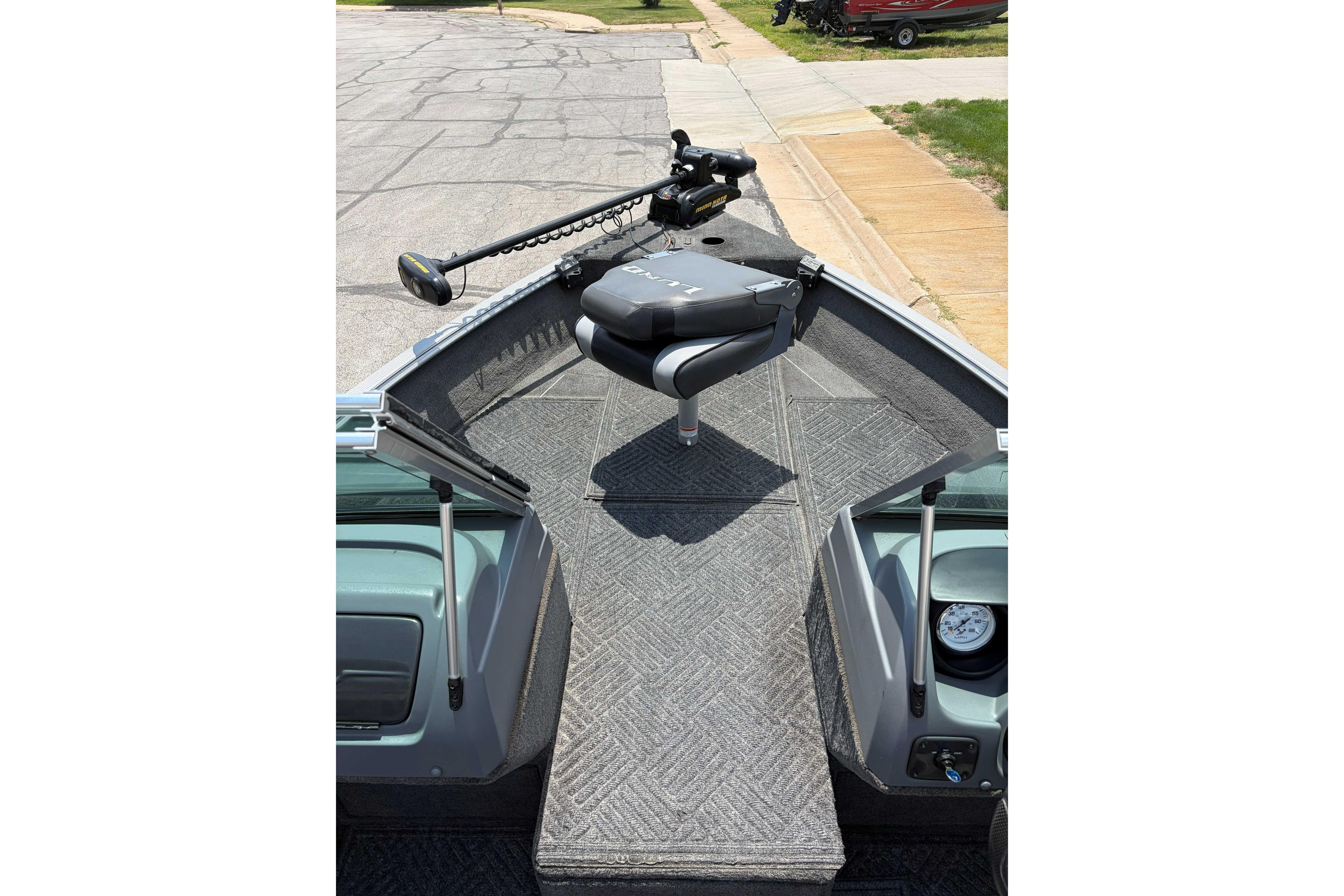 2014 Lund 1875 Impact XS boat interior with trolling motor and seating.