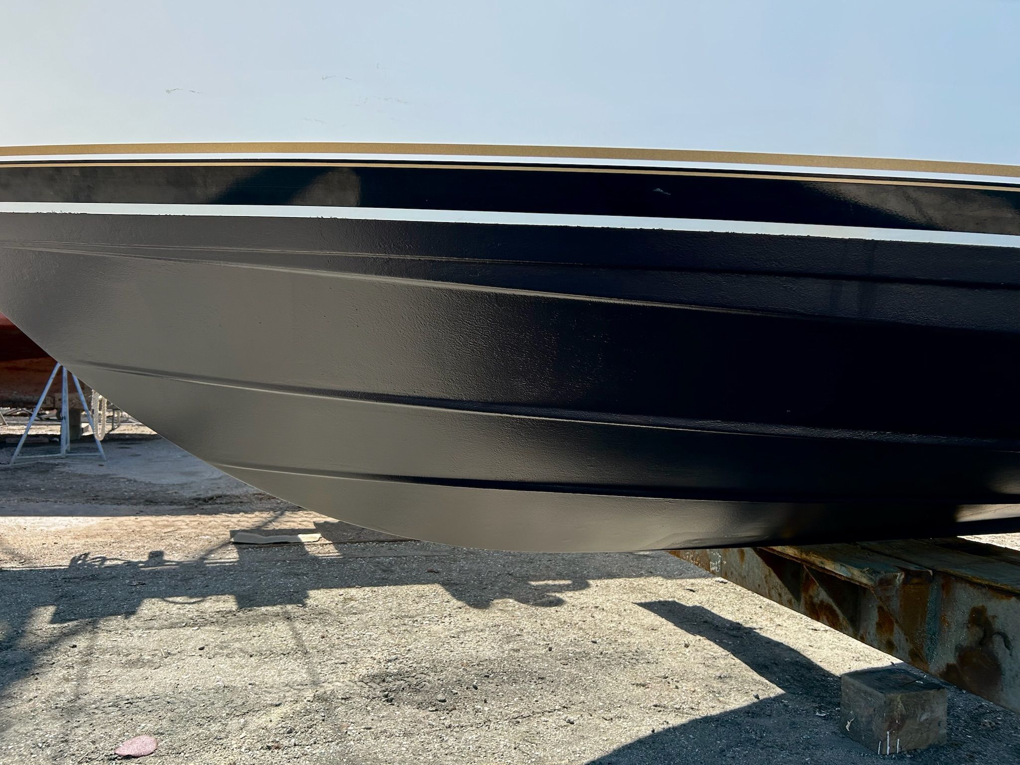 Hull of a 2000 Carver 356 Aft Cabin Motor Yacht on dry dock.