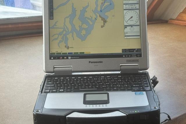 Panasonic Toughbook displaying nautical map inside 1984 Uniflite YACHTHOME.