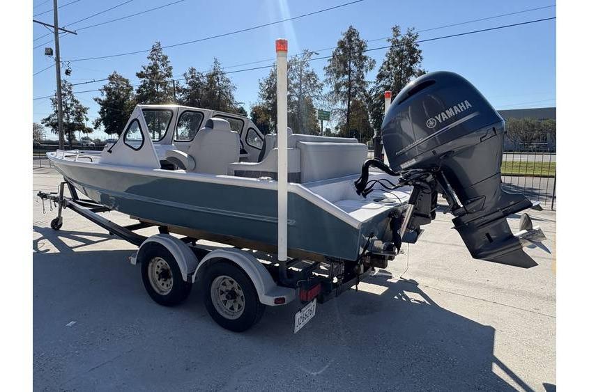 1997 Scully's 18 WT boat on trailer with Yamaha outboard motor.