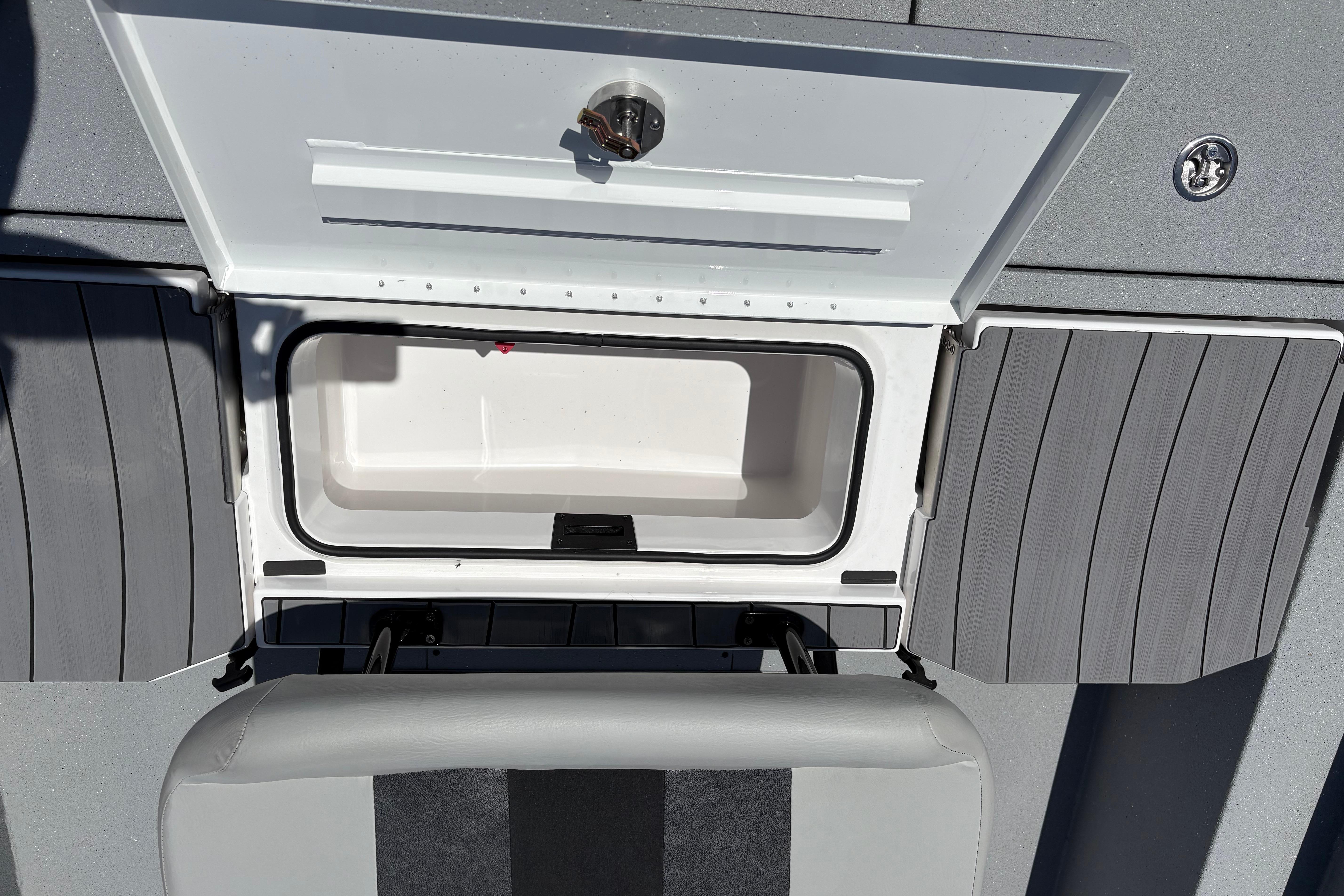 Open storage compartment on 2026 Vexus ACX 2150 boat, featuring sleek design and functionality.