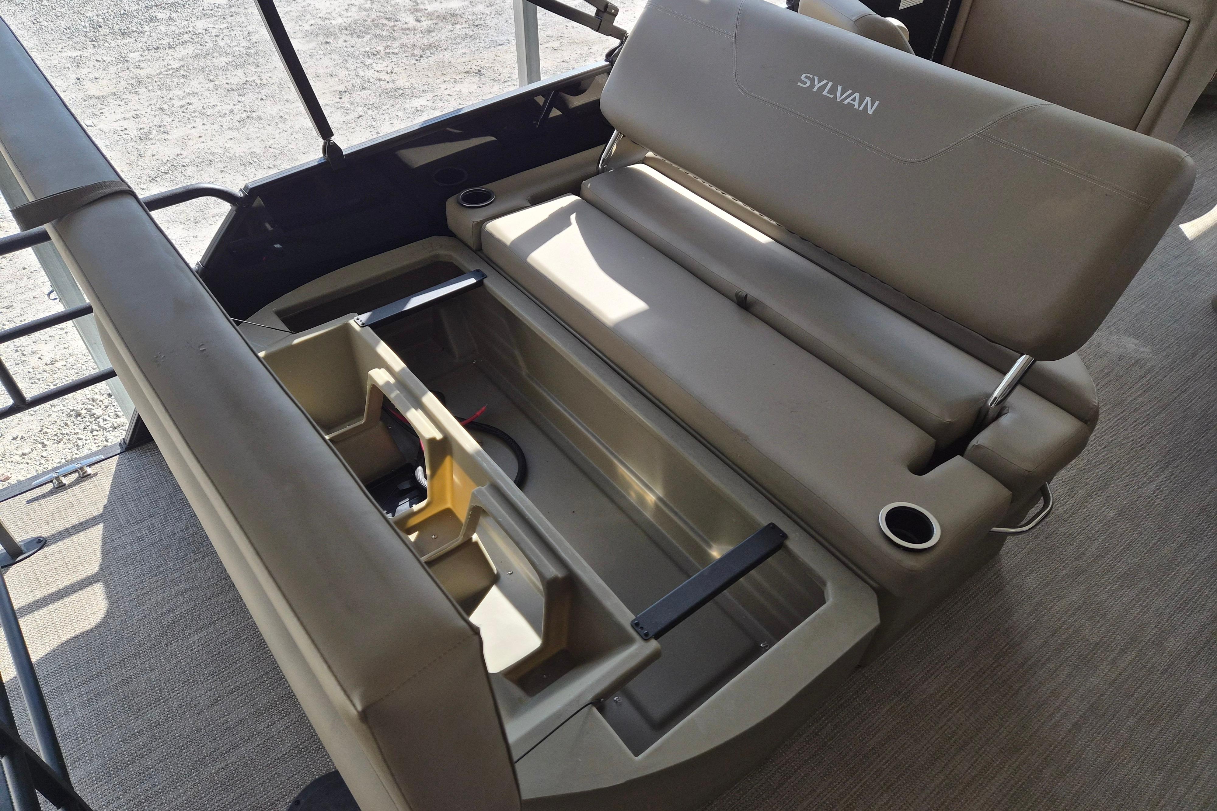 2026 Sylvan Mirage 820 CLZ DH boat interior with storage compartment and seating.