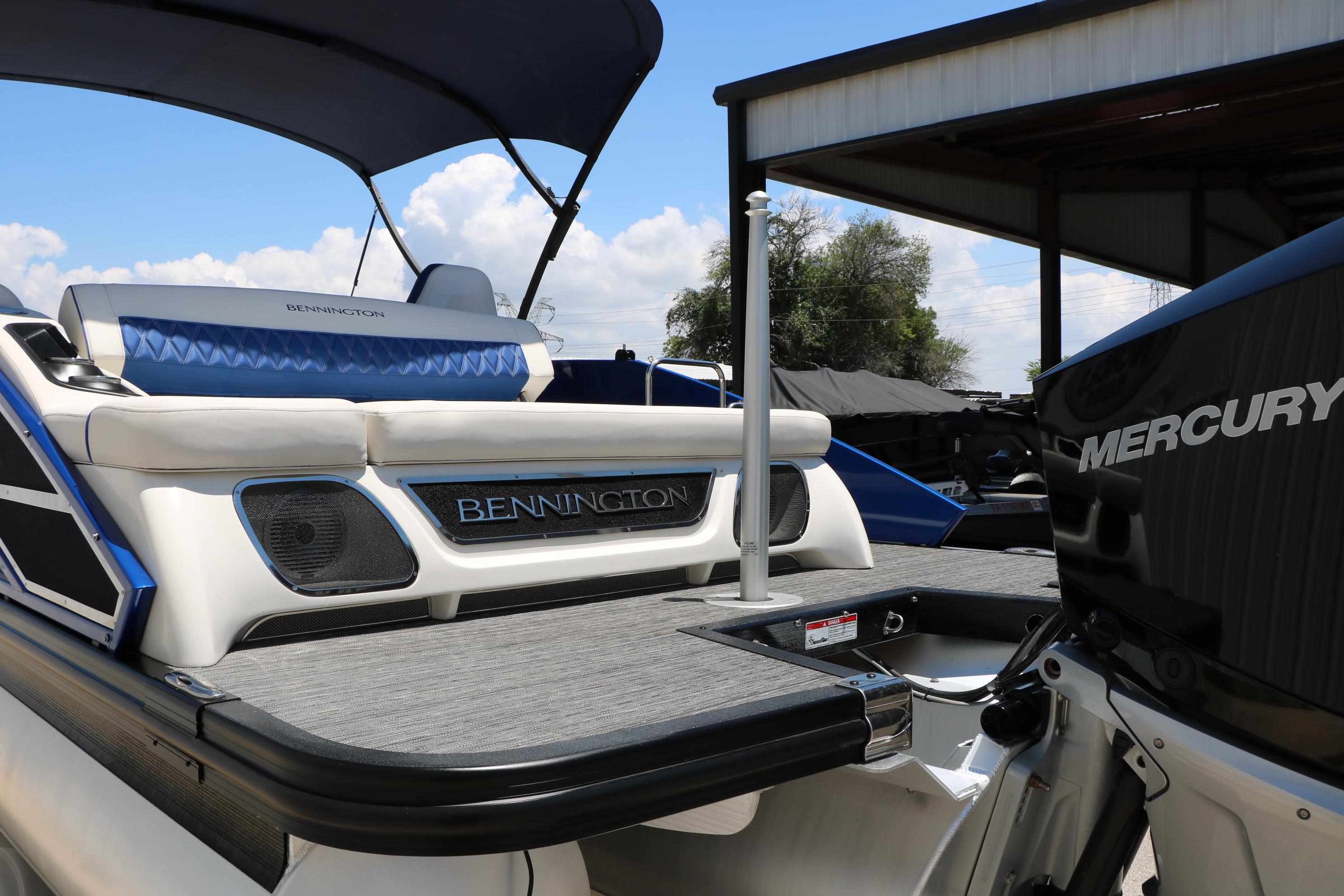 2024 Bennington 23 RX Swingback boat with Mercury engine, featuring sleek design and comfortable seating.