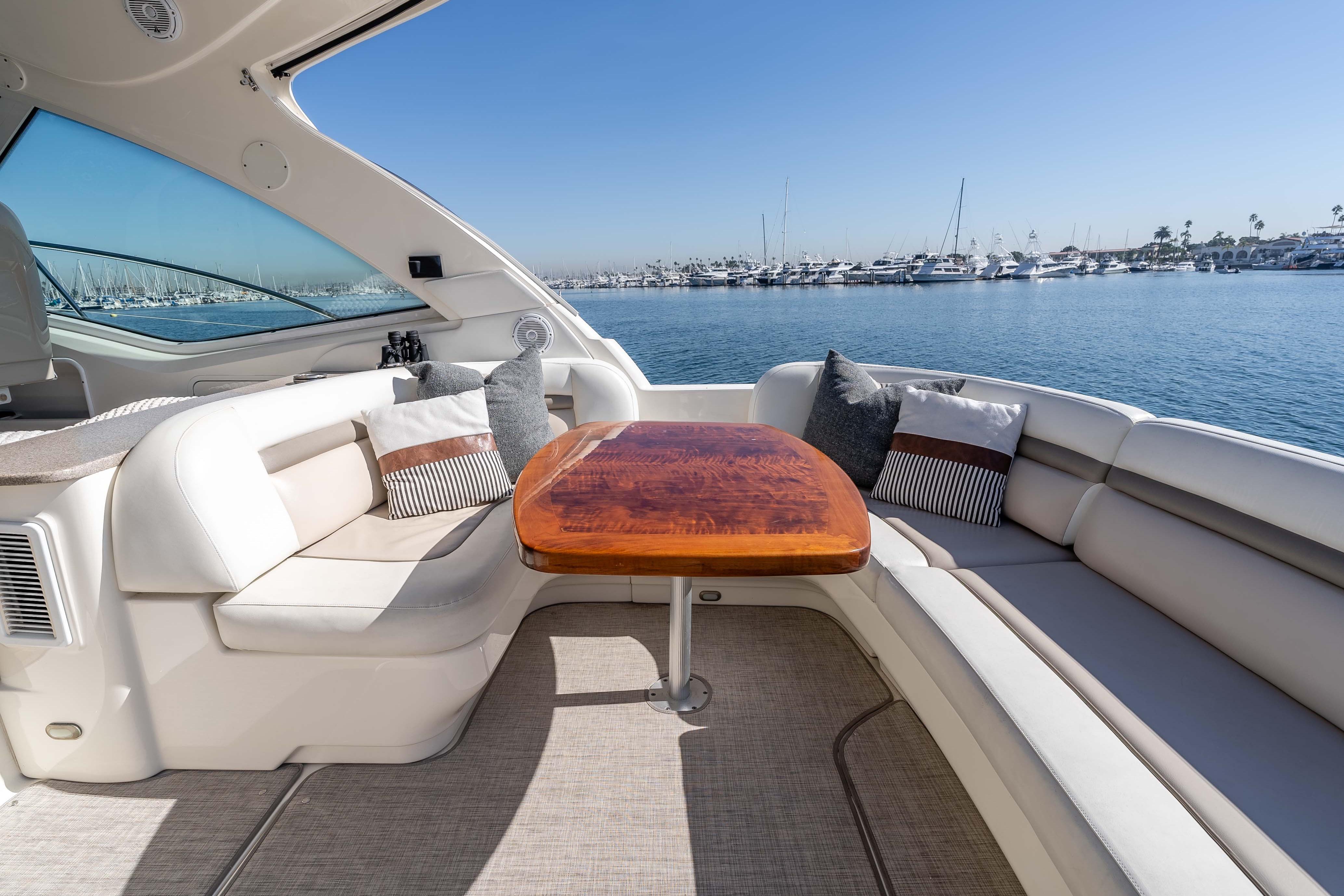 Luxurious 2007 Sea Ray 48 Sundancer yacht interior with elegant seating and ocean view.