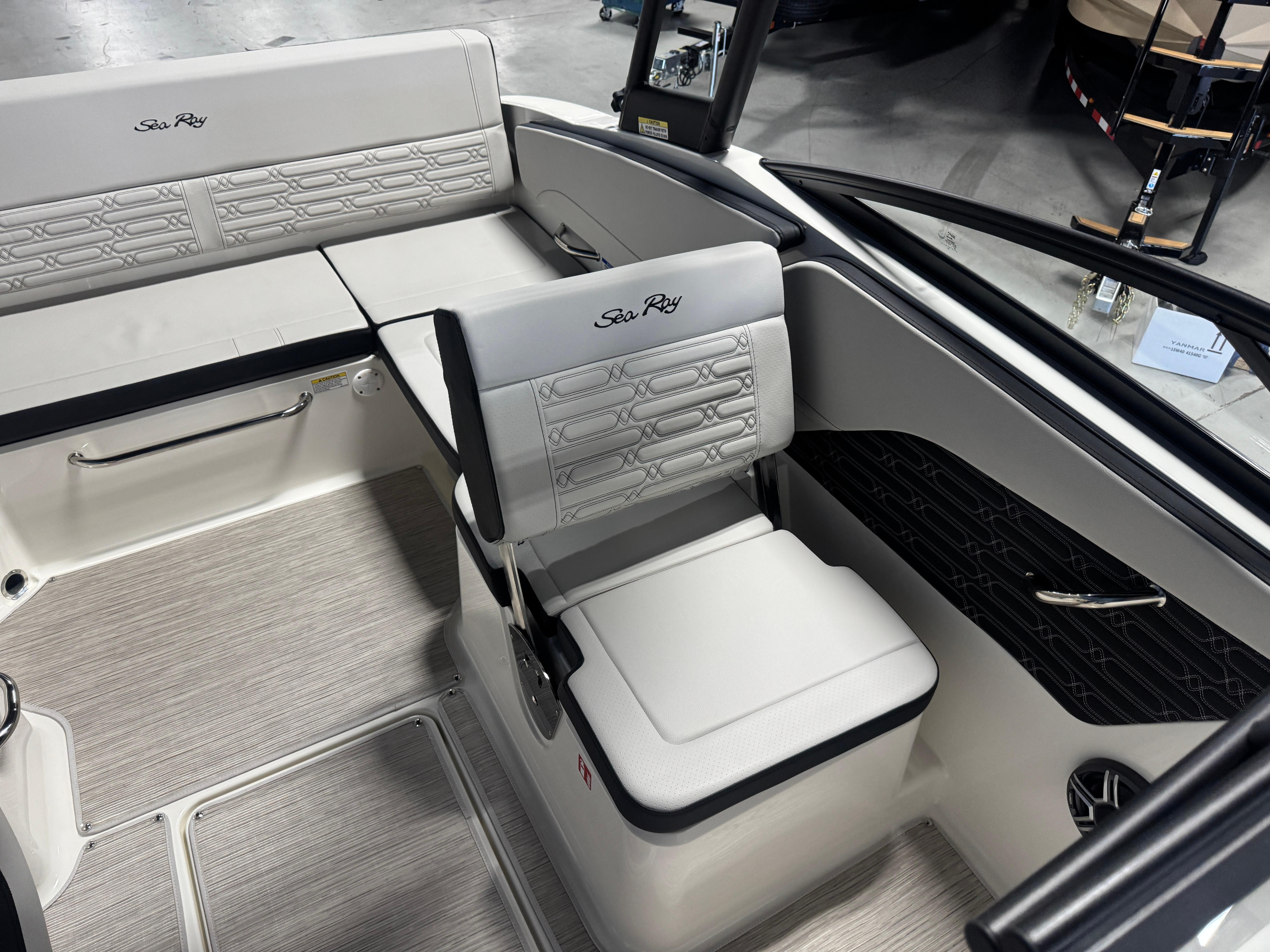 2026 Sea Ray SPX 210 boat interior with white seating and modern design.