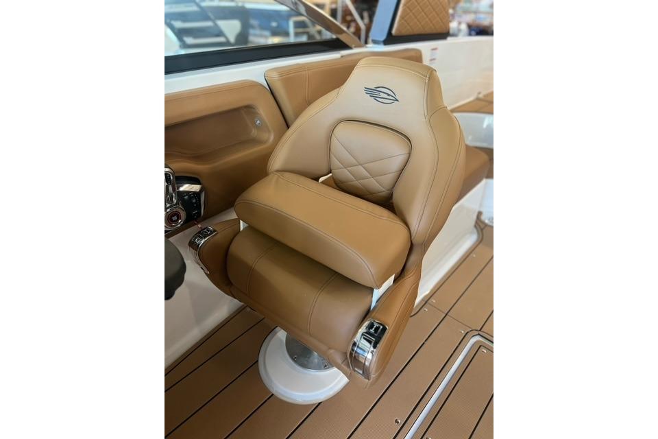 2025 Chaparral 247 SSX boat seat with tan leather and elegant stitching.