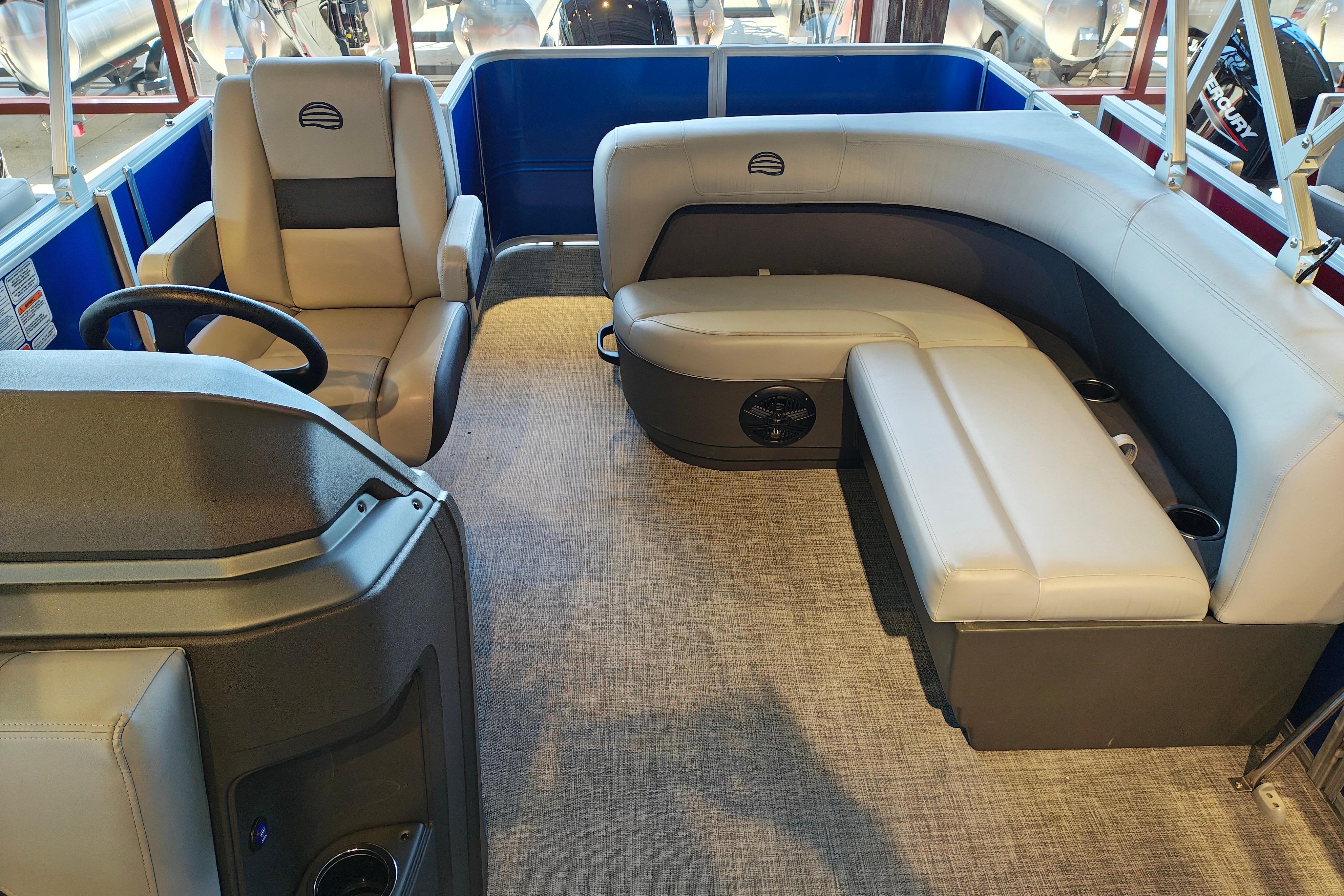 2026 Sun Tracker Party Barge 18 DLX interior with plush seating and modern design.