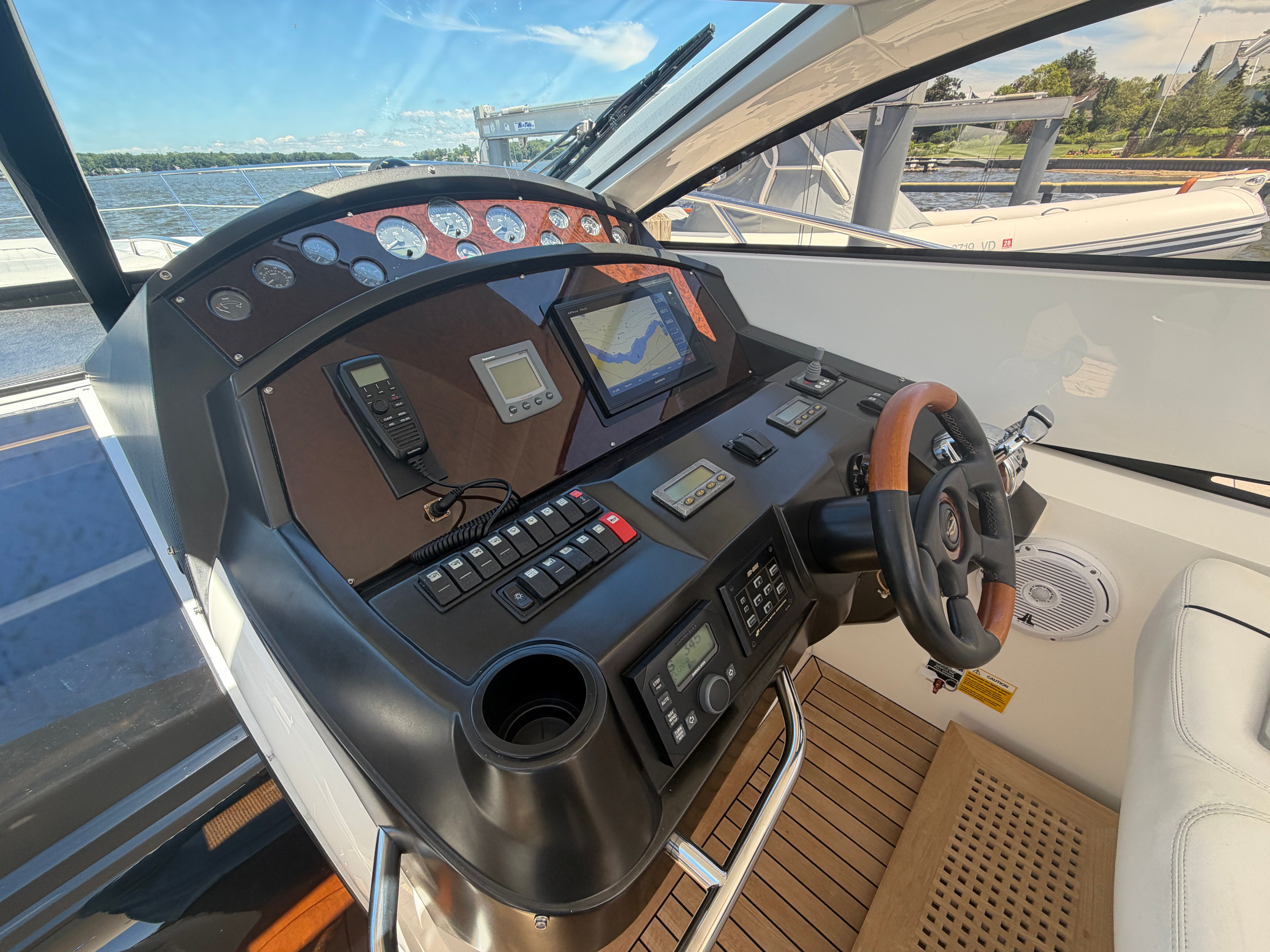 The cockpit of a 2008 Sunseeker Portofino 53 with modern navigation instruments.