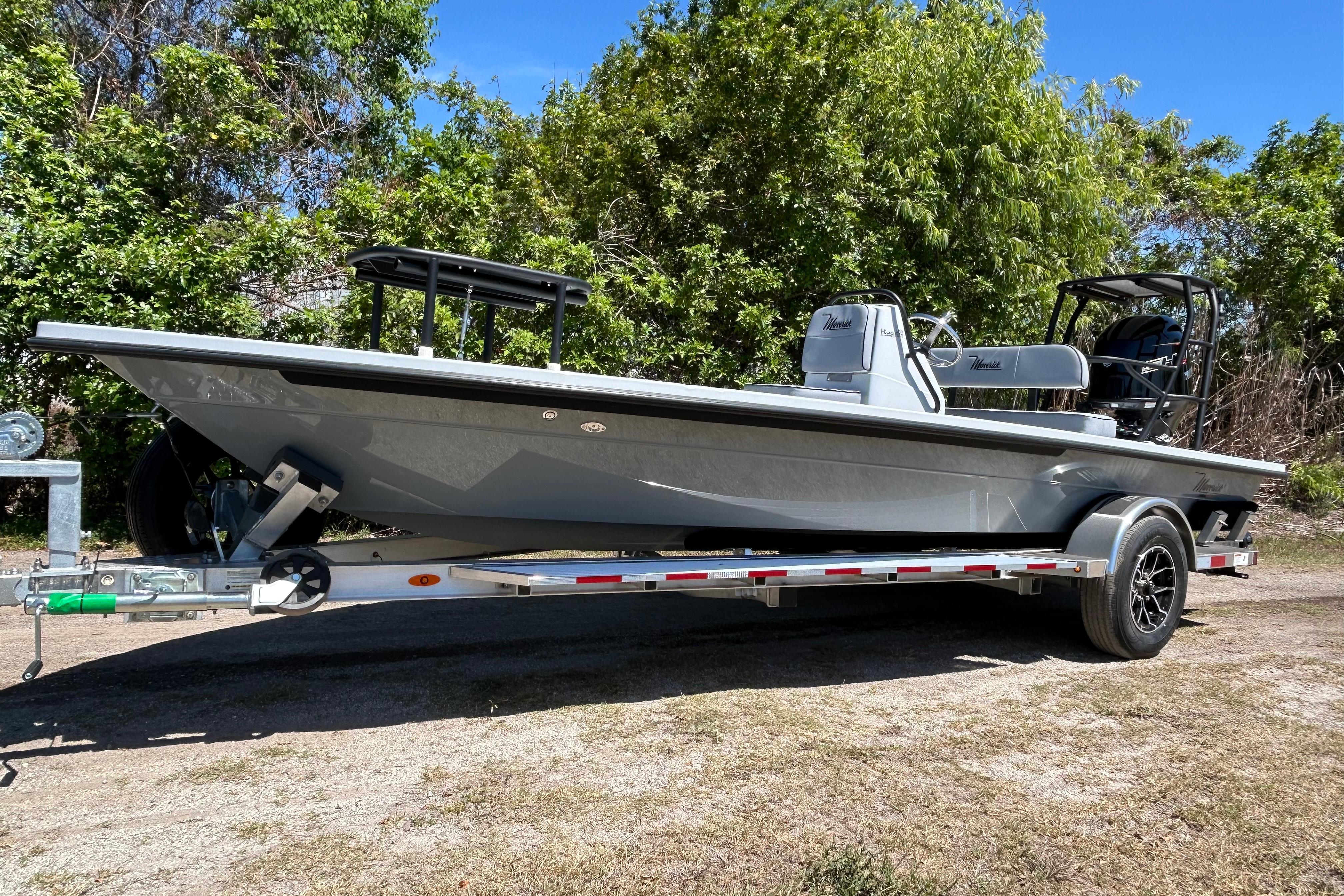 2026 Maverick 18 HPX-V boat on trailer, parked outdoors with trees in background.