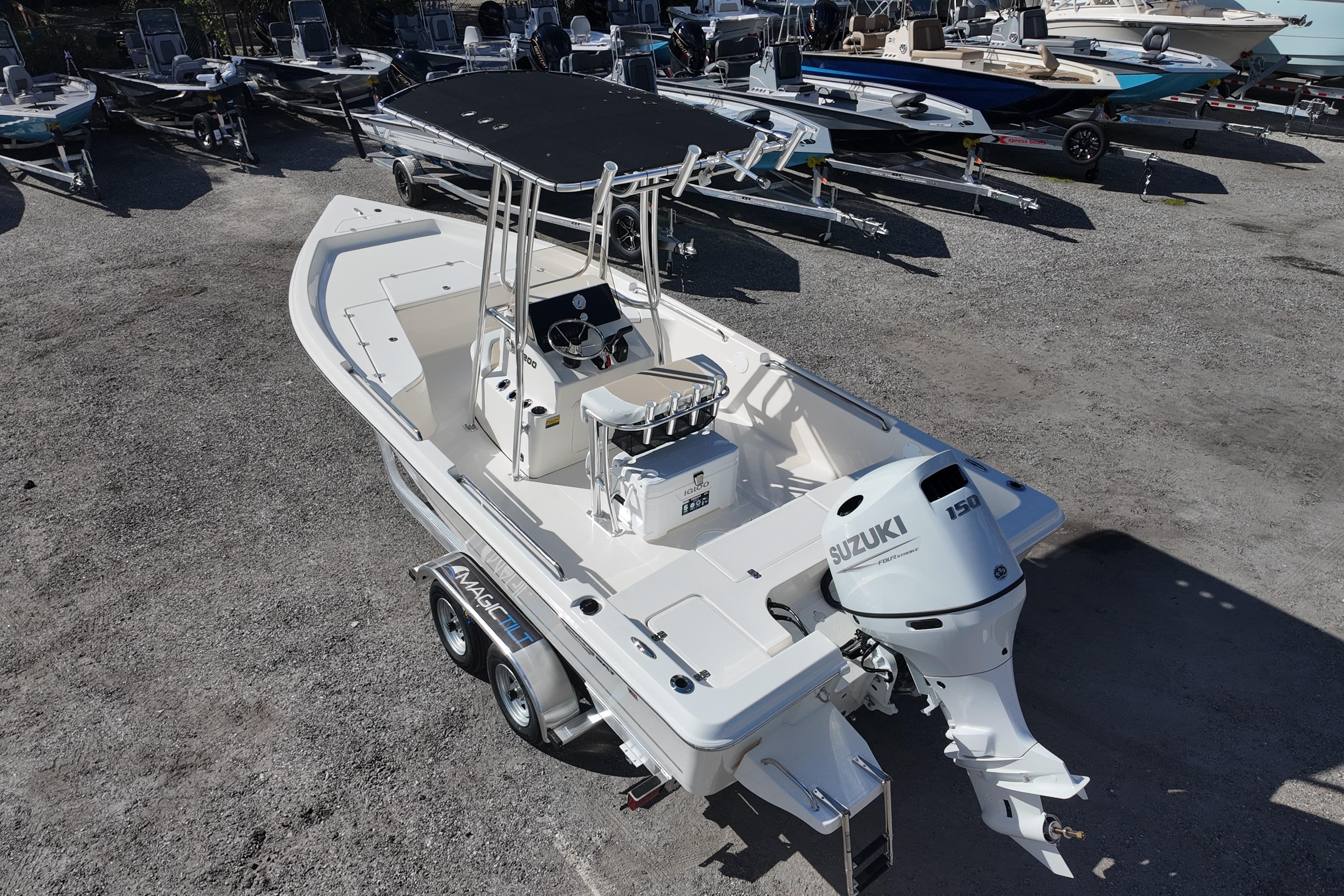 2026 Bulls Bay 2200 boat with Suzuki 150 engine, parked on a trailer in a dealership lot.