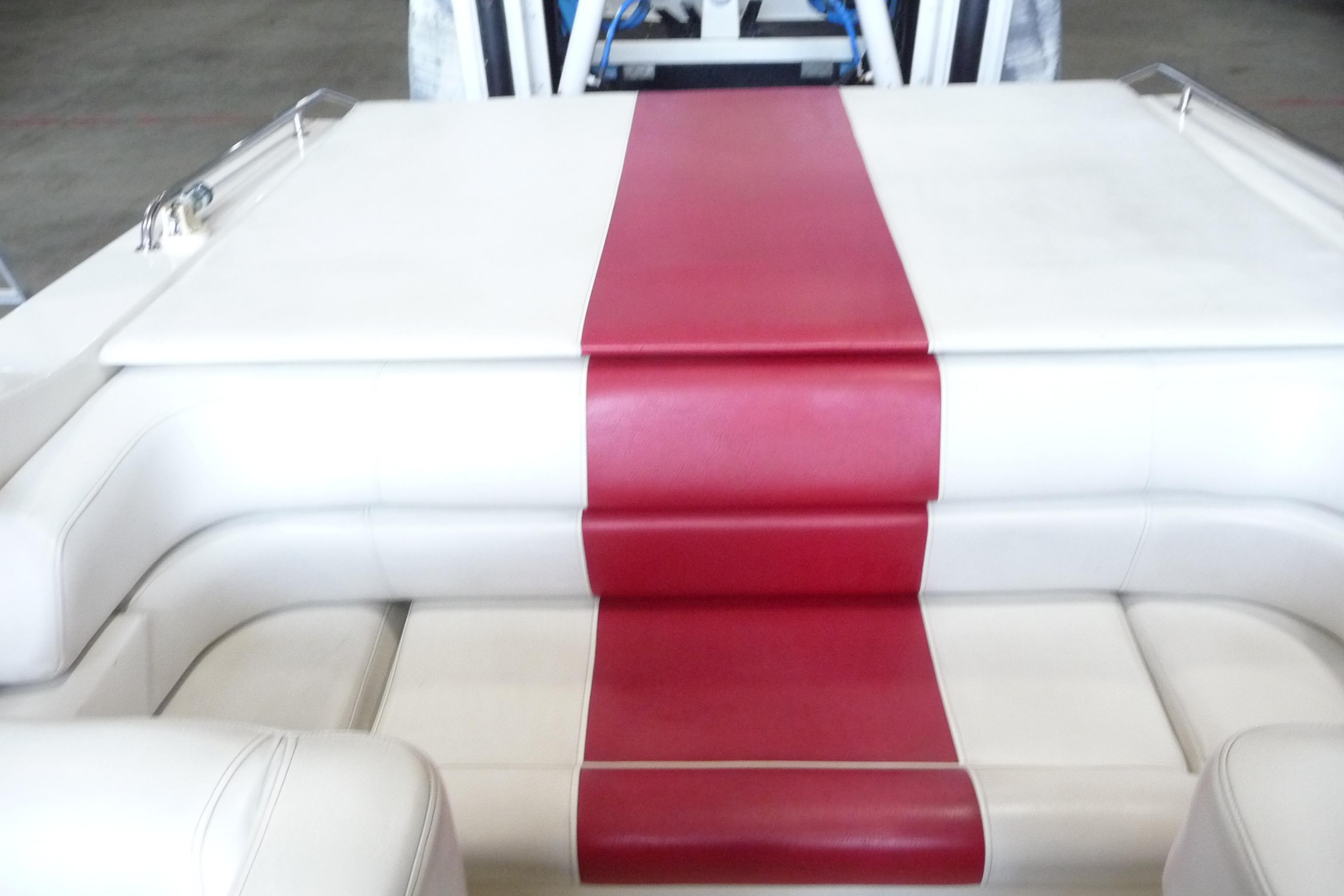 1989 Baja 280 Sportfish boat interior with red and white seating.