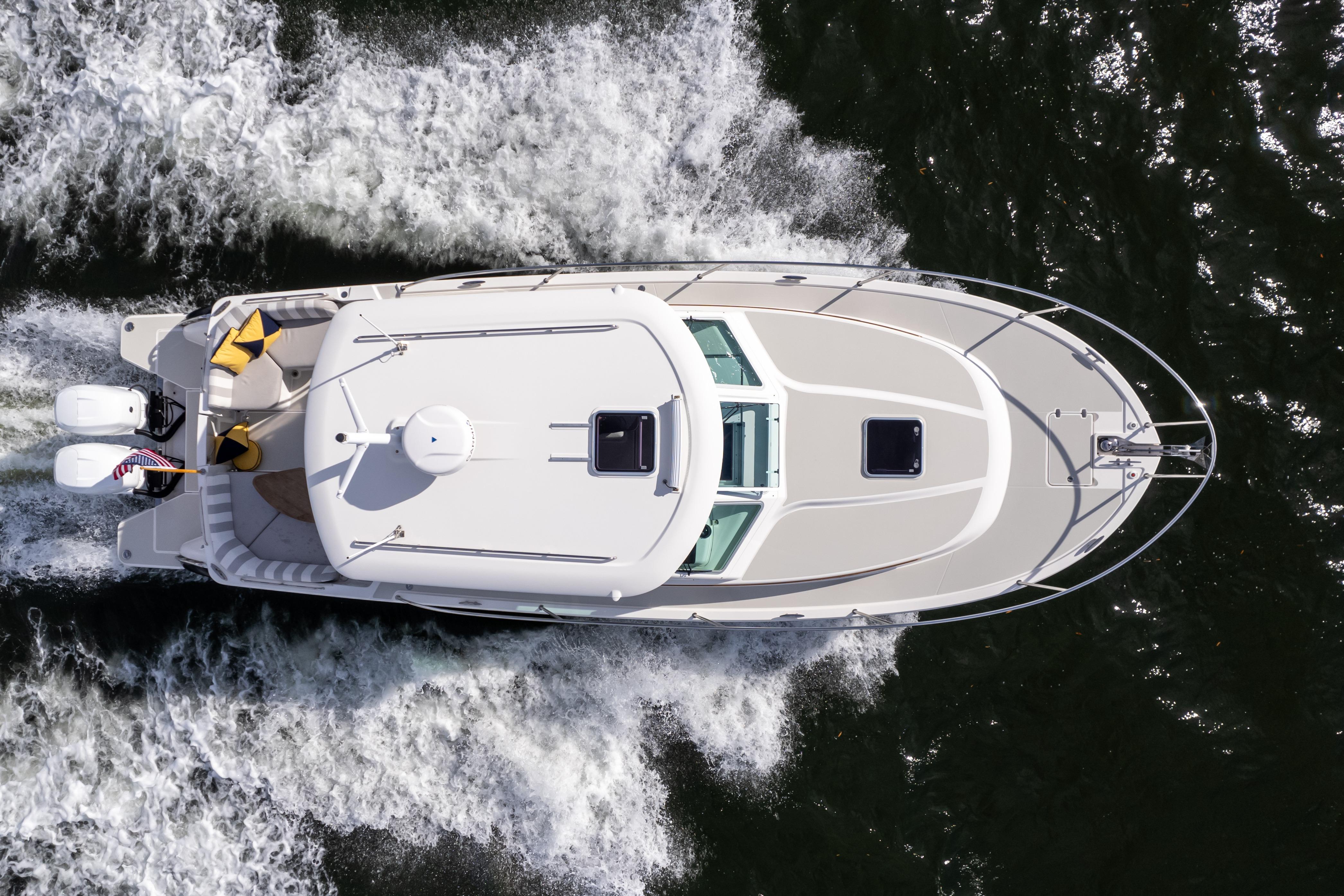 Aerial view of 2023 Back Cove 340 boat cruising on water.