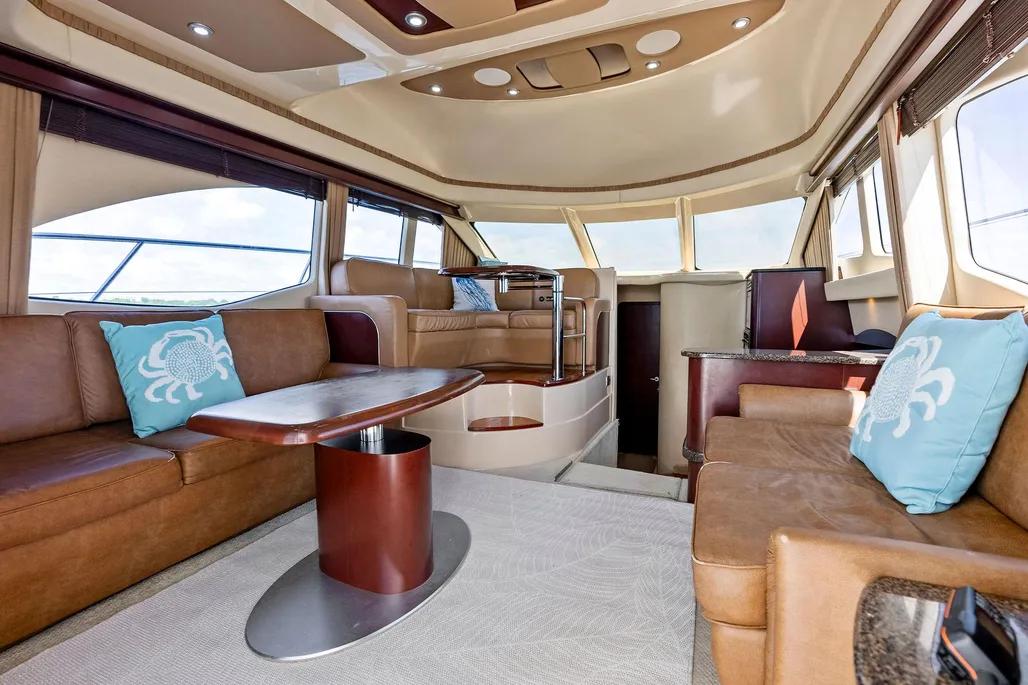 Luxurious interior of 2007 Sea Ray 44 Sedan Bridge yacht with leather seating and modern design.