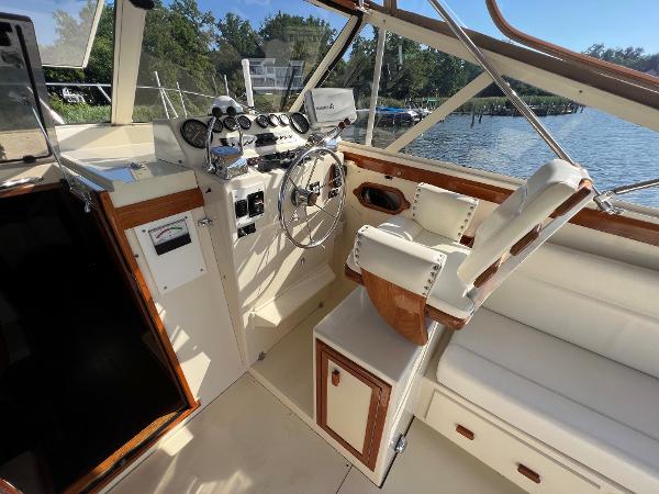 Interior view of a 1985 Viking 35 Express boat with steering wheel and instruments.